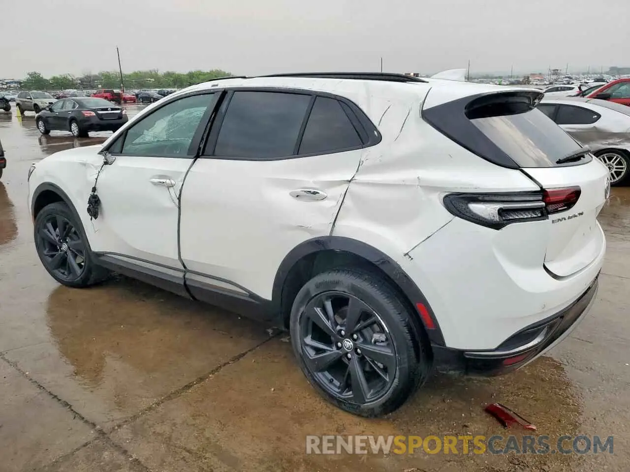 2 fotografías del automóvil dañado LRBAZLR42PD031320 BUICK ENVISION 2023