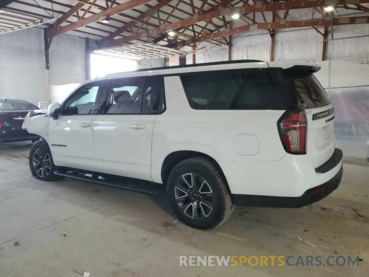 2 fotografías del automóvil dañado 1GNSKDKDXPR402129 CHEVROLET SUBURBAN 2023