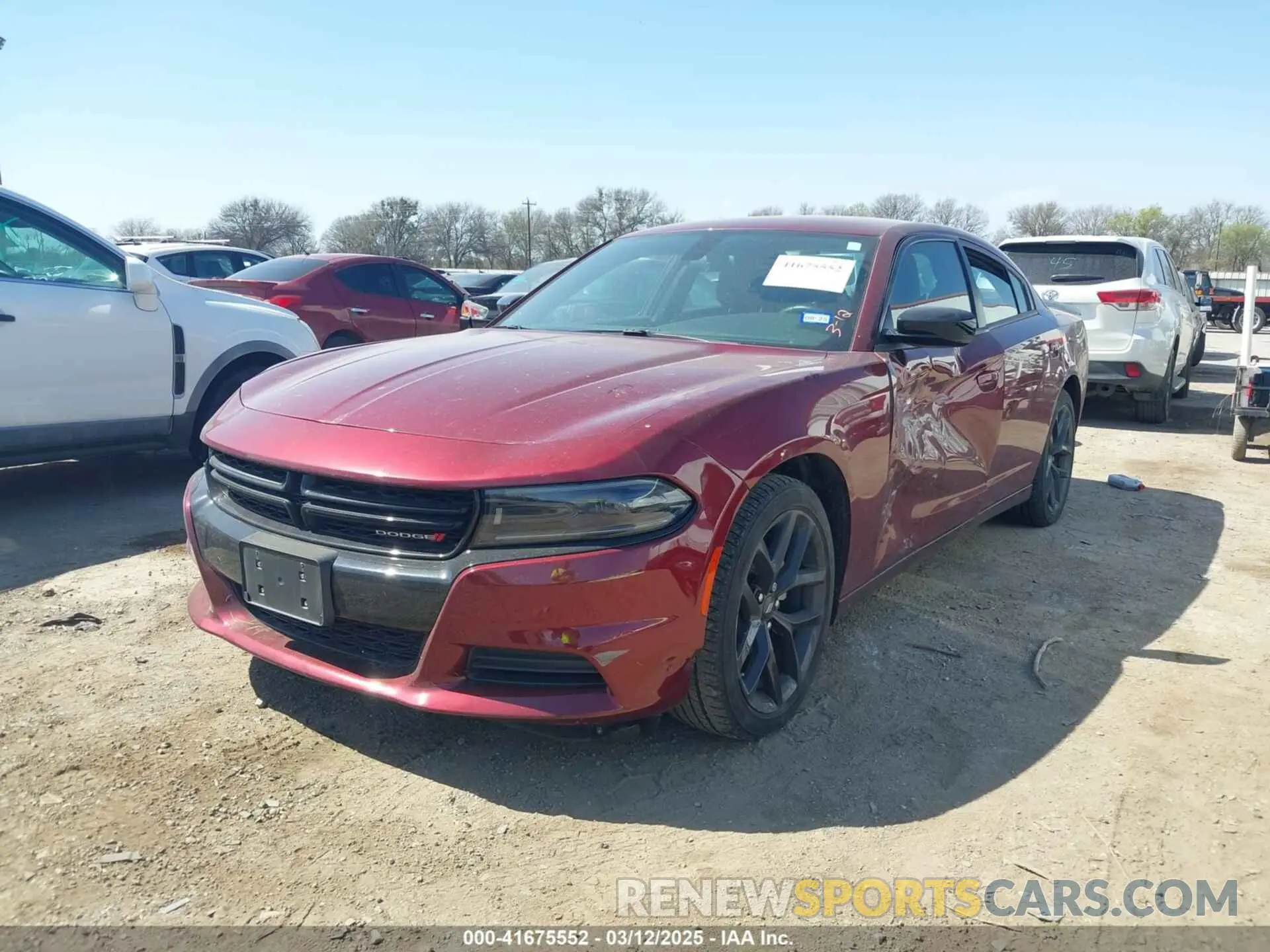 2 fotografías del automóvil dañado 2C3CDXBGXNH203229 DODGE CHARGER 2022