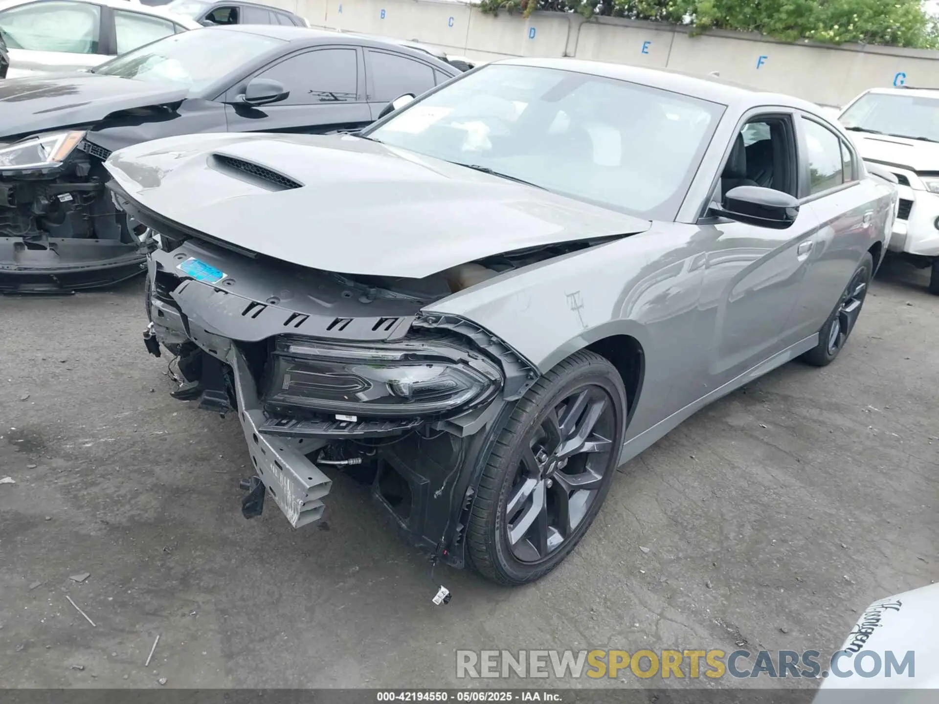 2 fotografías del automóvil dañado 2C3CDXHG7PH698855 DODGE CHARGER 2023