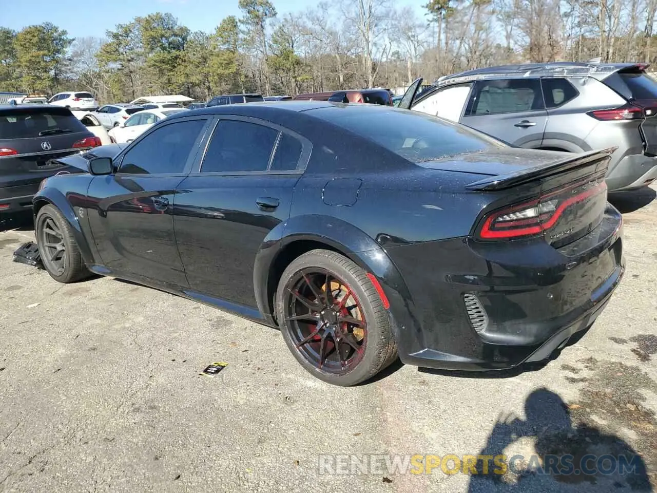 2 fotografías del automóvil dañado 2C3CDXL97PH514569 DODGE CHARGER 2023