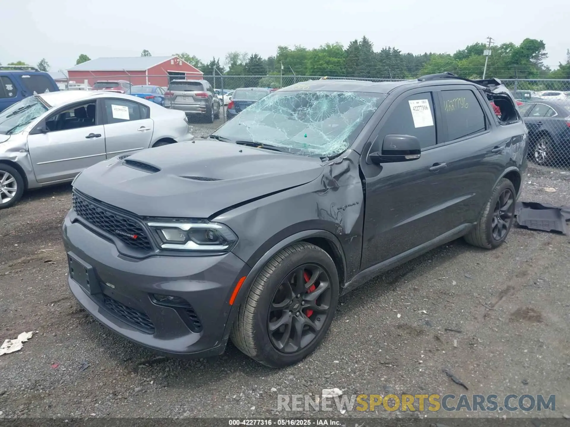 2 fotografías del automóvil dañado 1C4SDJCT0PC695209 DODGE DURANGO 2023