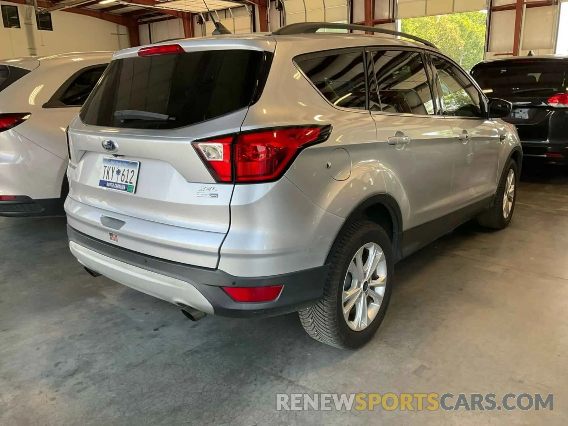 14 fotografías del automóvil dañado 1FMCU9HD8KUB82387 FORD ESCAPE 2019
