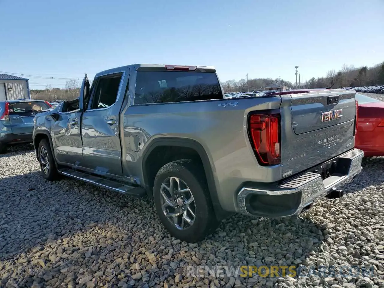 2 fotografías del automóvil dañado 3GTUUDEL9PG314283 GMC SIERRA 2023