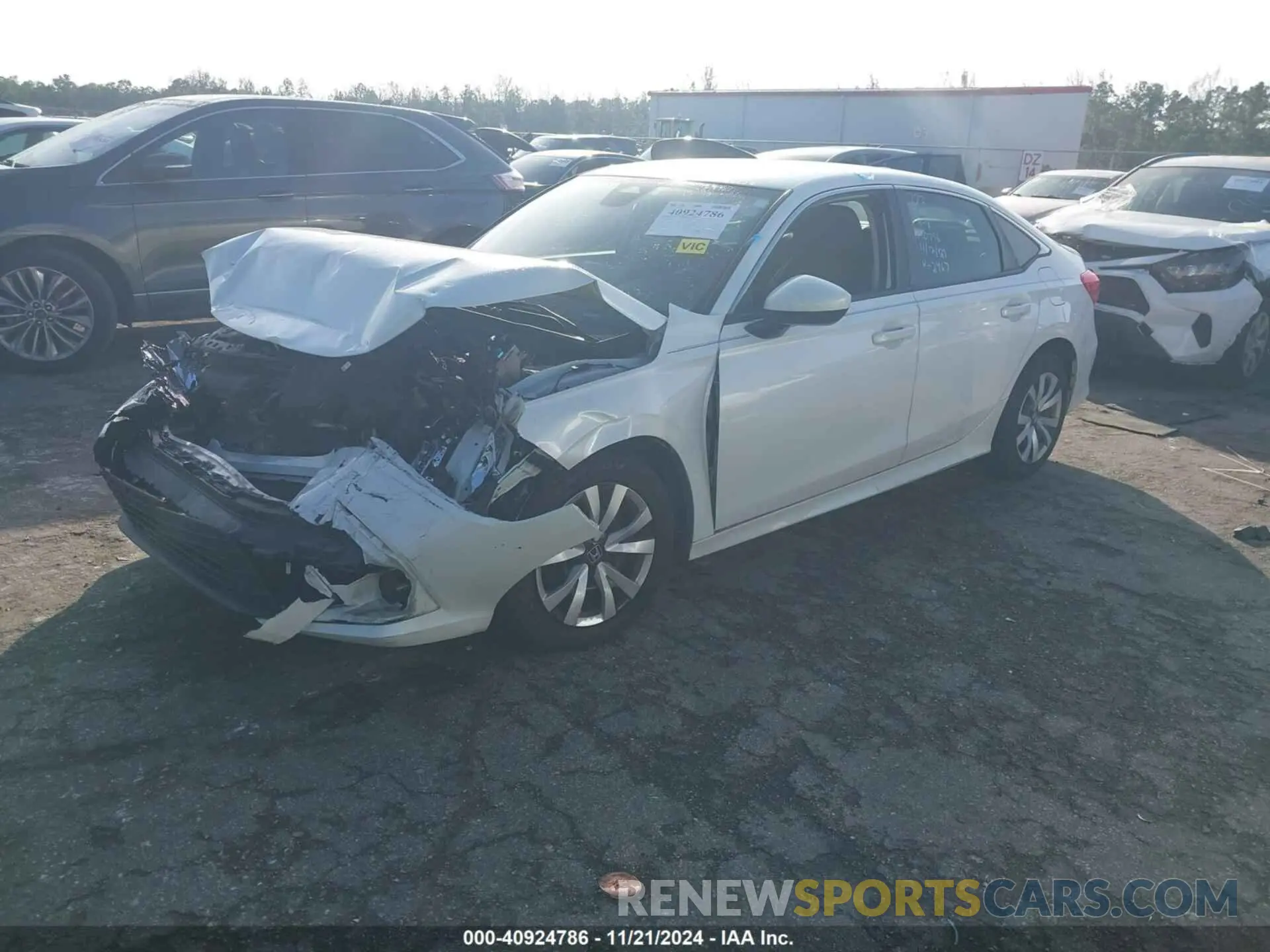 2 fotografías del automóvil dañado 2HGFE2F24NH532467 HONDA CIVIC 2022