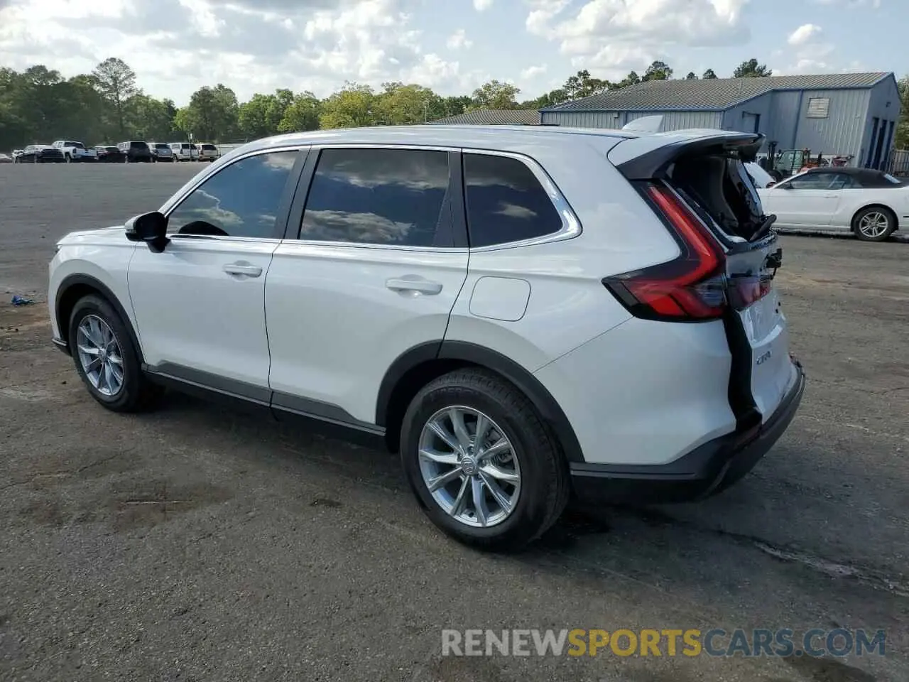 2 fotografías del automóvil dañado 5J6RS3H70SL002976 HONDA CRV 2025