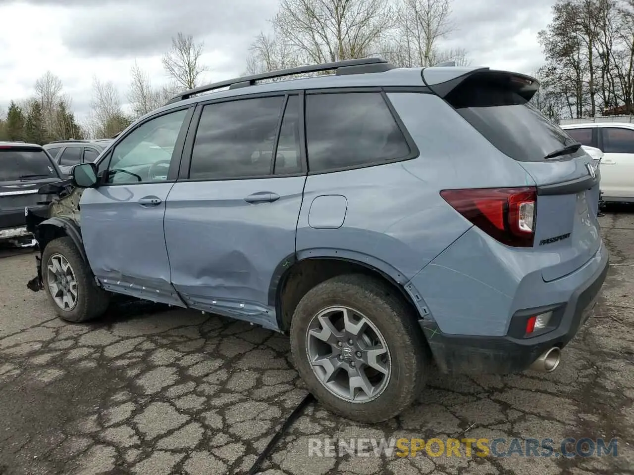 2 fotografías del automóvil dañado 5FNYF8H63PB031232 HONDA PASSPORT 2023