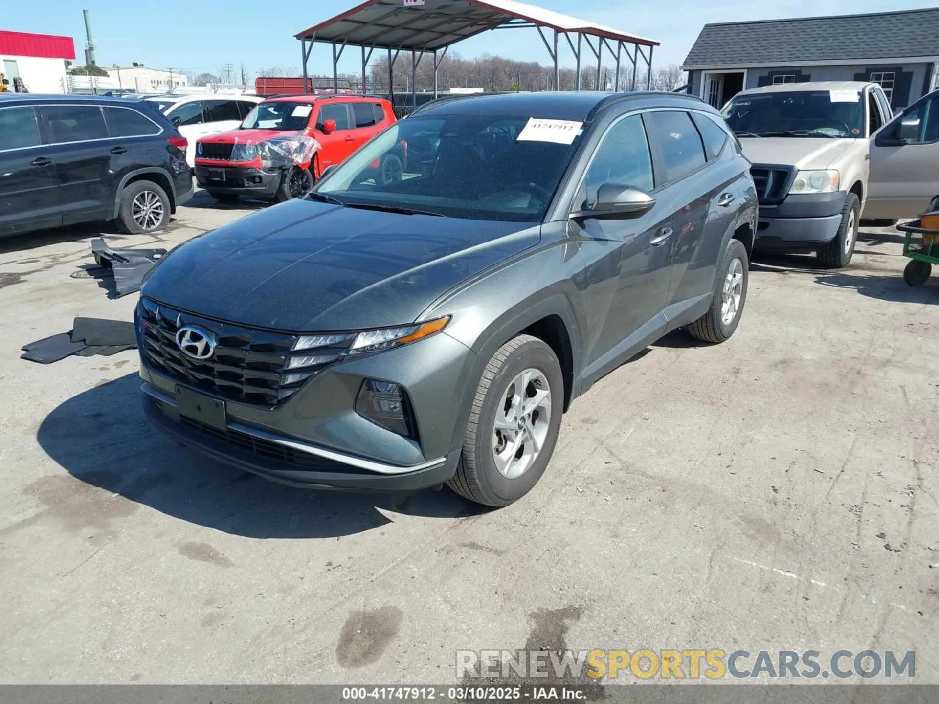 2 fotografías del automóvil dañado 5NMJBCAE5PH237670 HYUNDAI TUCSON 2023