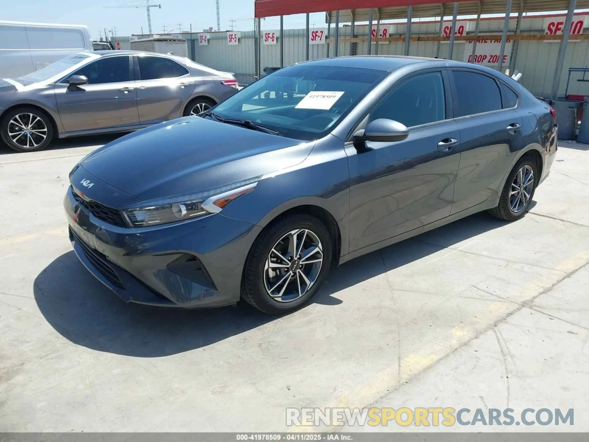 2 fotografías del automóvil dañado 3KPF24AD4NE433459 KIA FORTE 2022