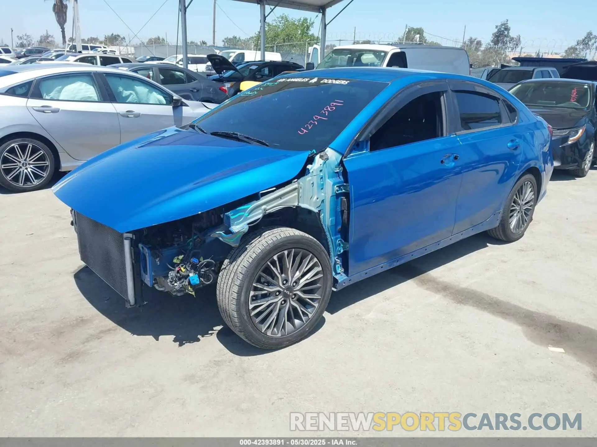 2 fotografías del automóvil dañado 3KPF54AD1NE431093 KIA FORTE 2022