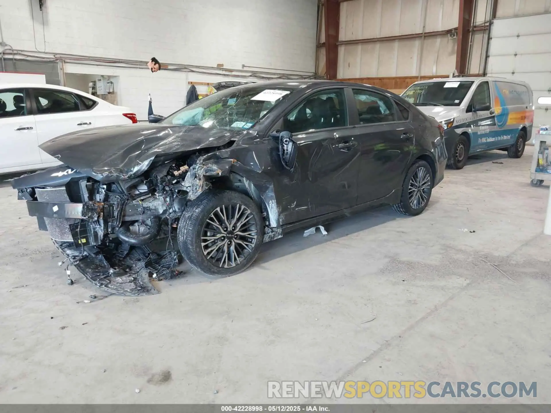 2 fotografías del automóvil dañado 3KPF54AD3PE581872 KIA FORTE 2023