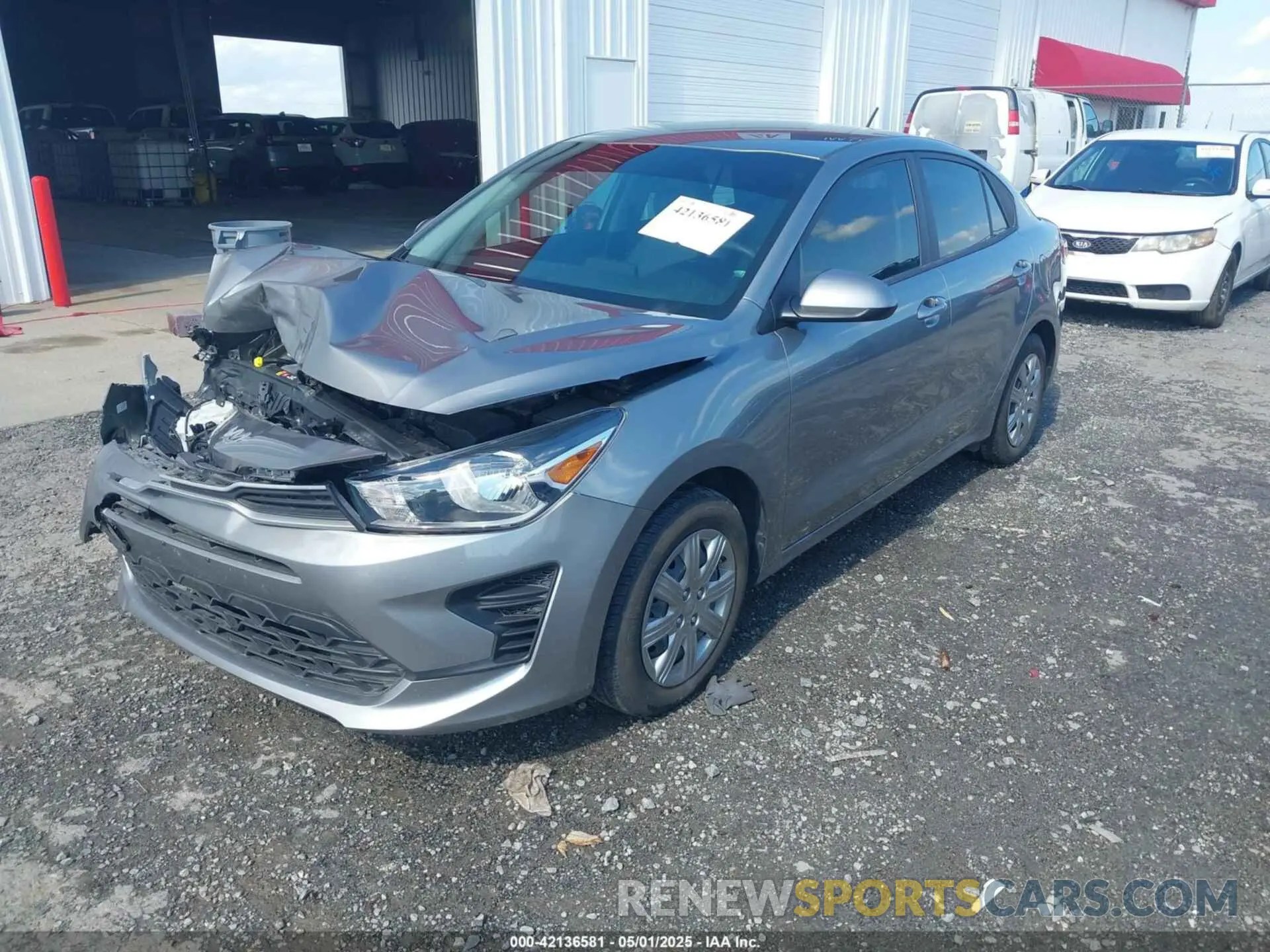 2 fotografías del automóvil dañado 3KPA24AD9NE488029 KIA RIO 2022