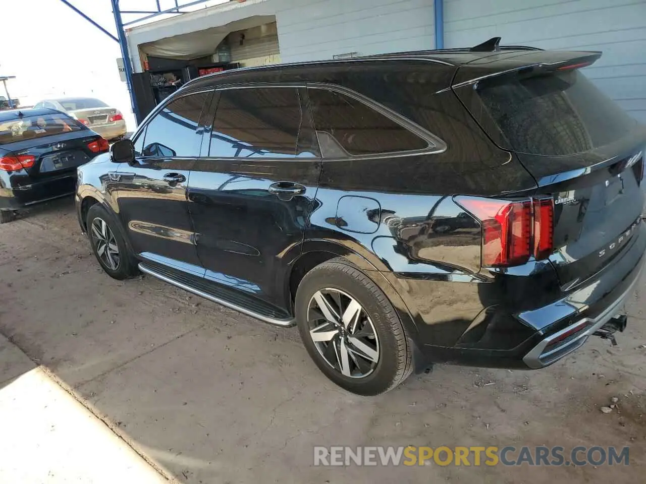 2 fotografías del automóvil dañado 5XYRL4LC2NG141651 KIA SORENTO 2022