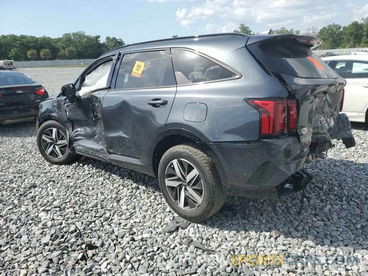 2 fotografías del automóvil dañado 5XYRL4LC5PG222422 KIA SORENTO 2023