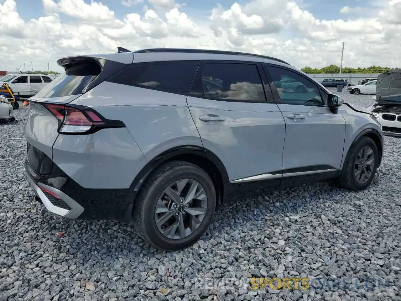 3 fotografías del automóvil dañado 5XYK43AF4PG080800 KIA SPORTAGE 2023