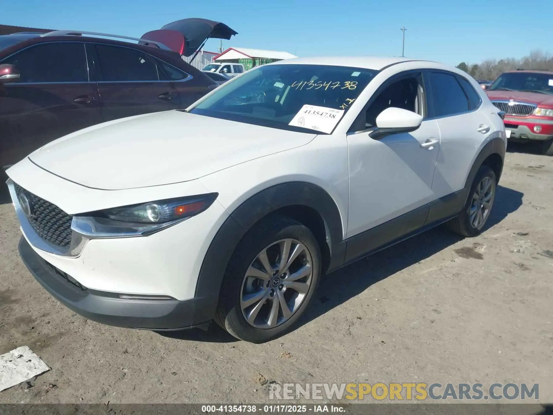 2 fotografías del automóvil dañado 3MVDMABL3MM239692 MAZDA CX-30 2021