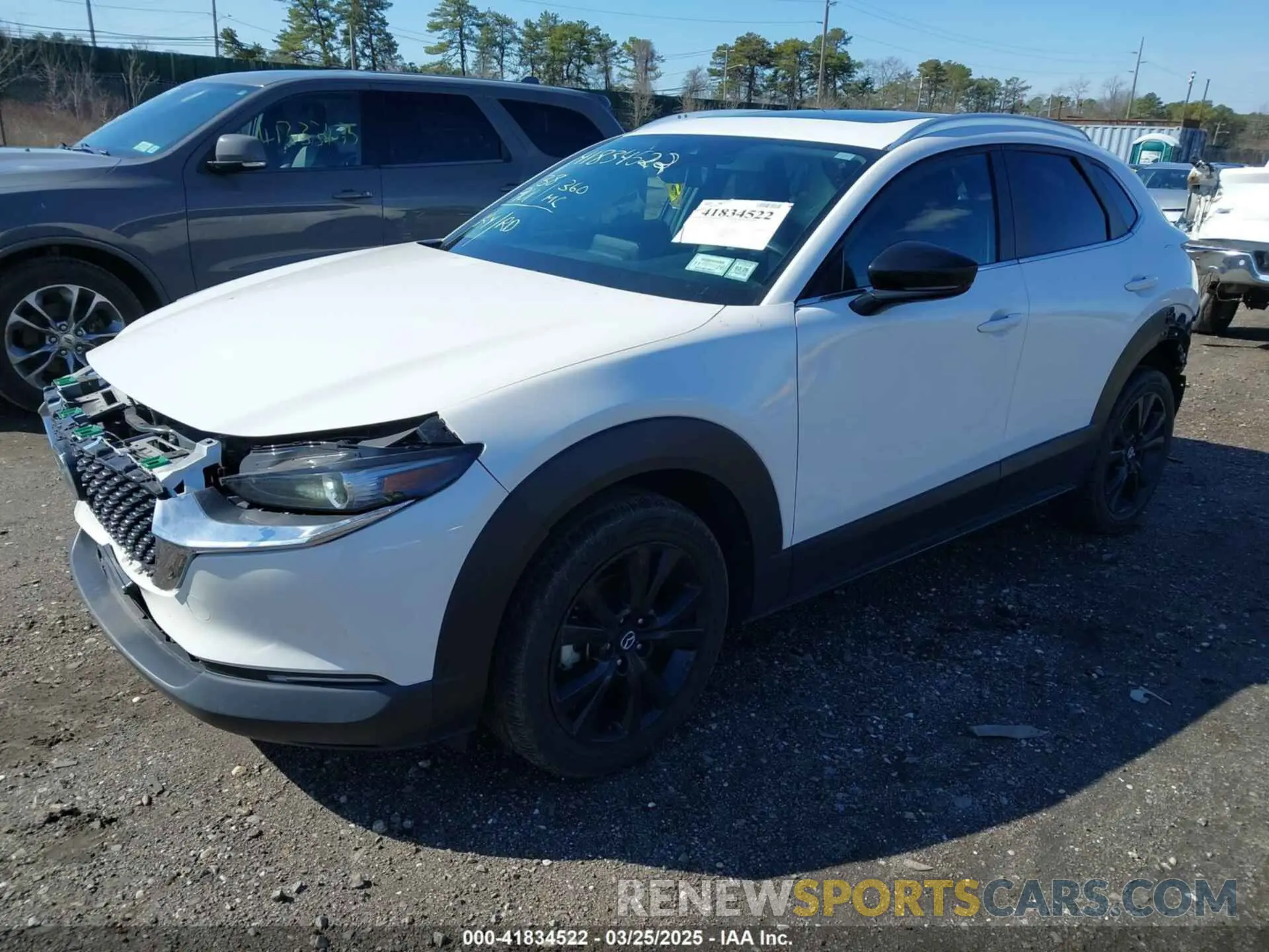 2 fotografías del automóvil dañado 3MVDMBAYXMM250823 MAZDA CX-30 2021