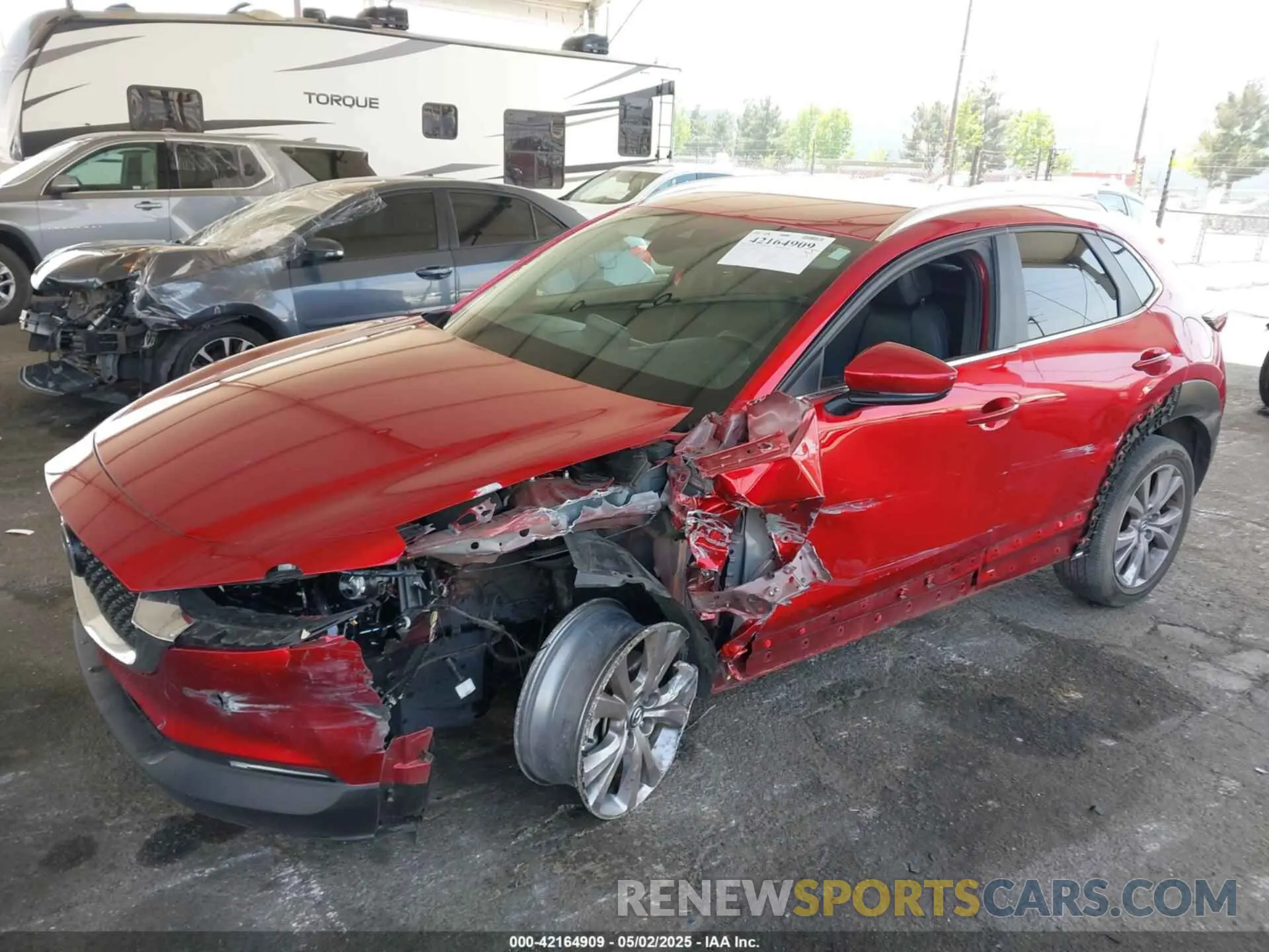 2 fotografías del automóvil dañado 3MVDMBBL2NM417034 MAZDA CX-30 2022