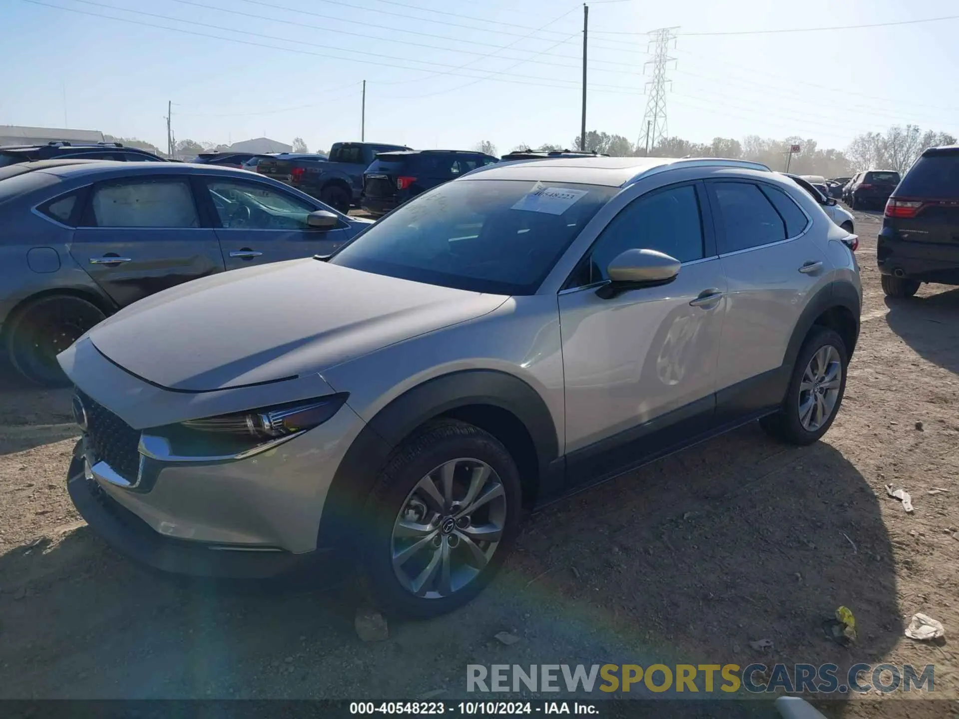 2 fotografías del automóvil dañado 3MVDMBDMXRM627652 MAZDA CX-30 2024