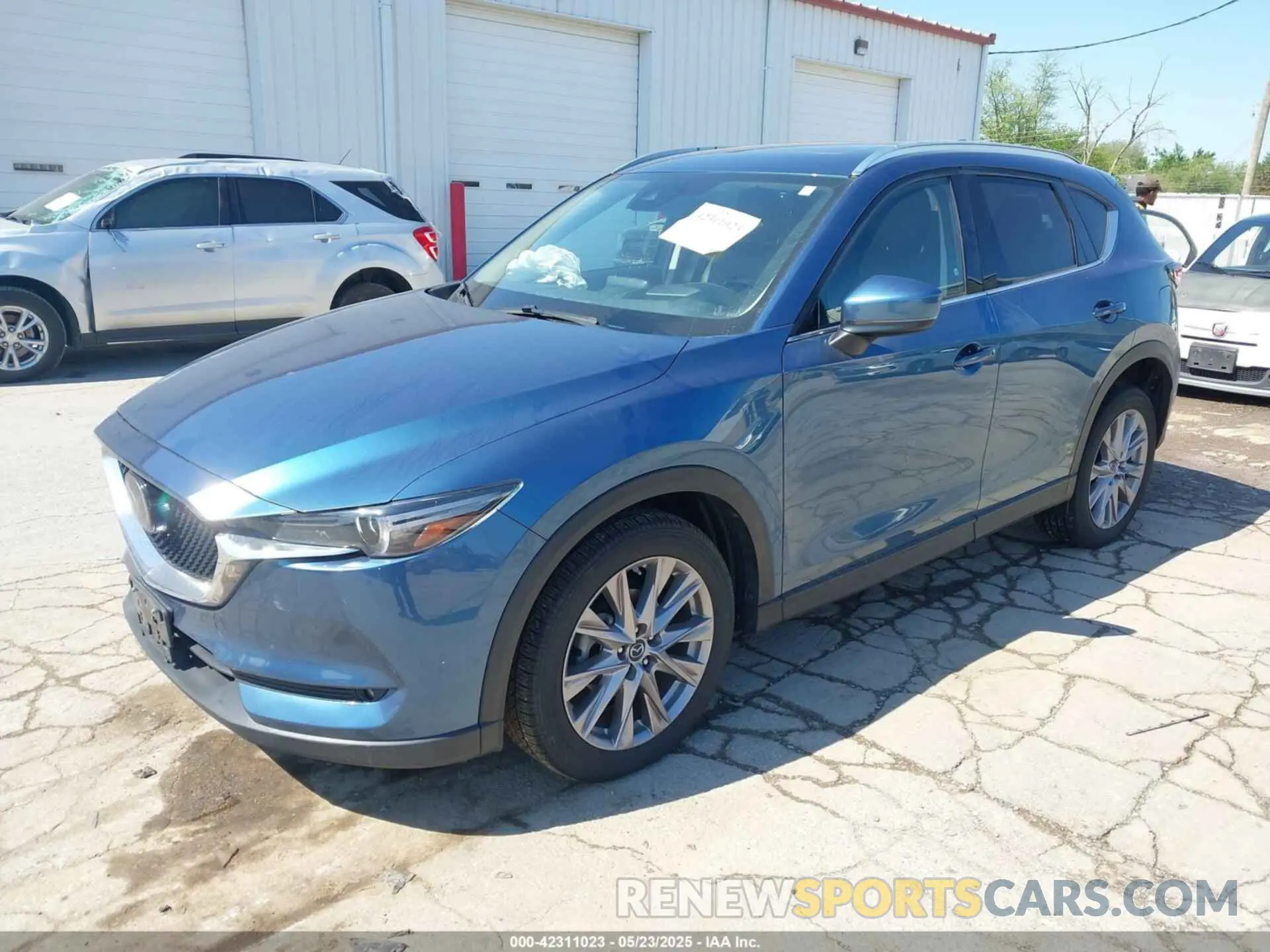 2 fotografías del automóvil dañado JM3KFBDM2K0583360 MAZDA CX-5 2019