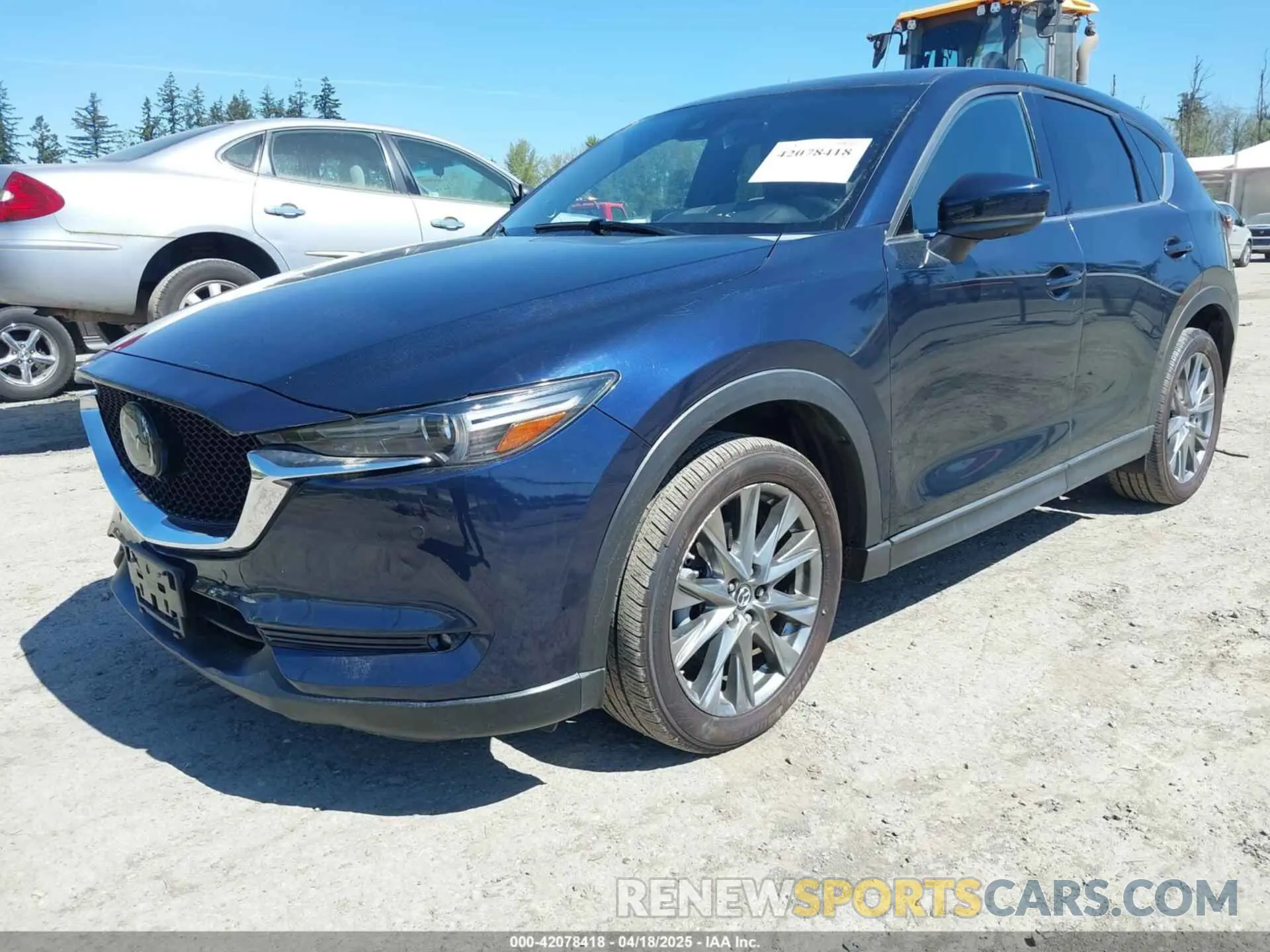 2 fotografías del automóvil dañado JM3KFBEY7K0589236 MAZDA CX-5 2019
