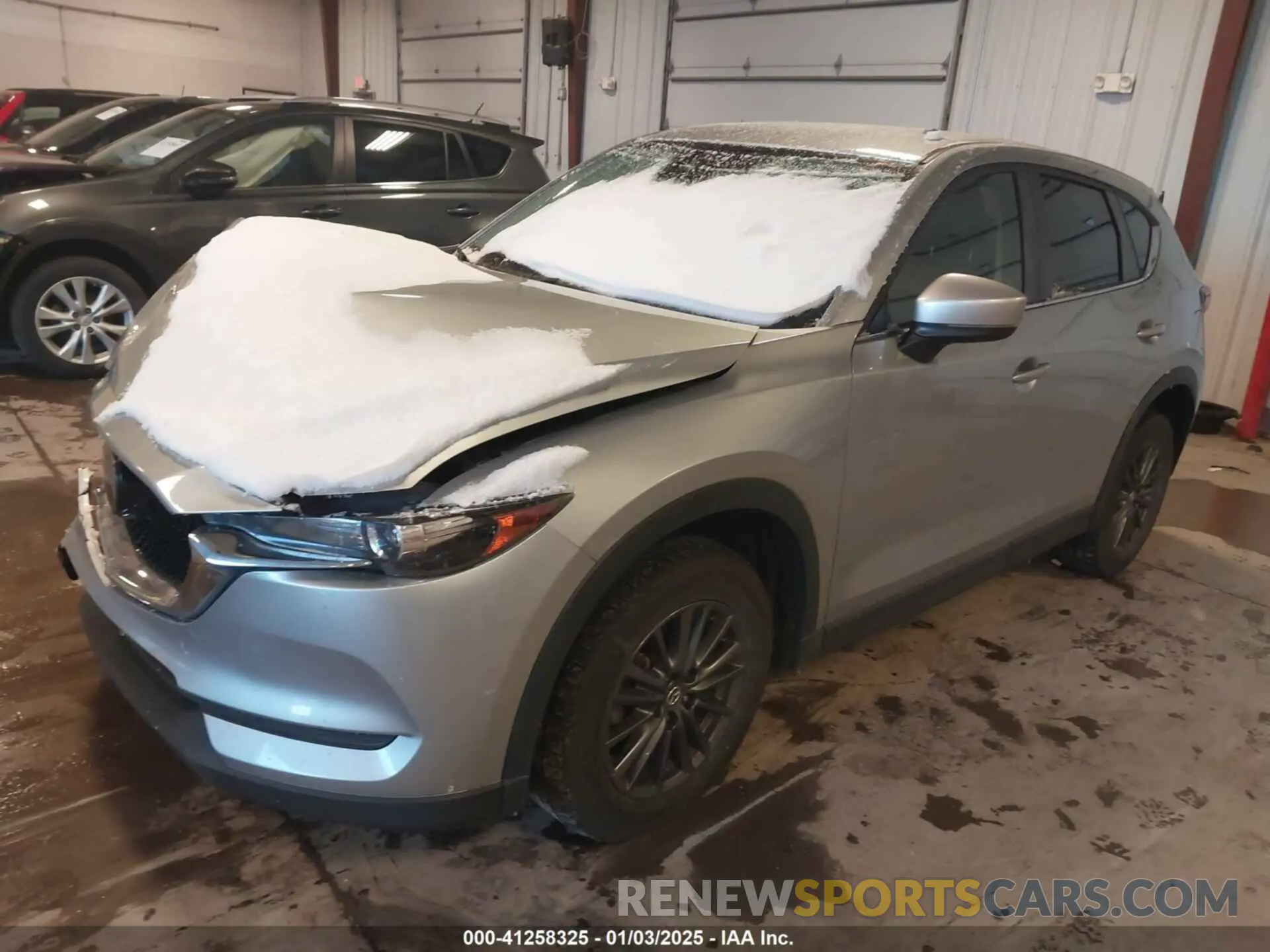 2 fotografías del automóvil dañado JM3KFACM0M0331234 MAZDA CX-5 2021