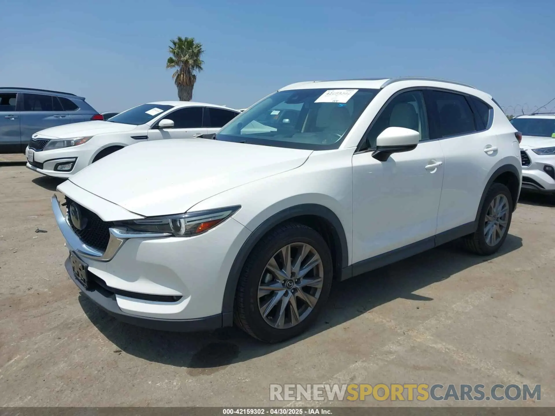 2 fotografías del automóvil dañado JM3KFADM5M0403849 MAZDA CX-5 2021