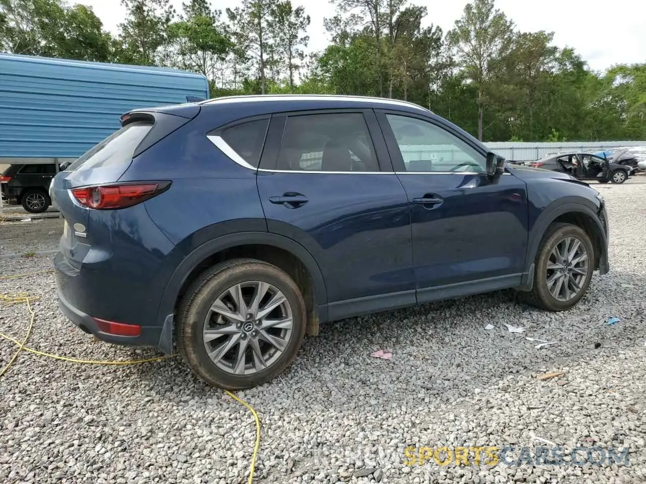 3 fotografías del automóvil dañado JM3KFADM8M0303938 MAZDA CX-5 2021