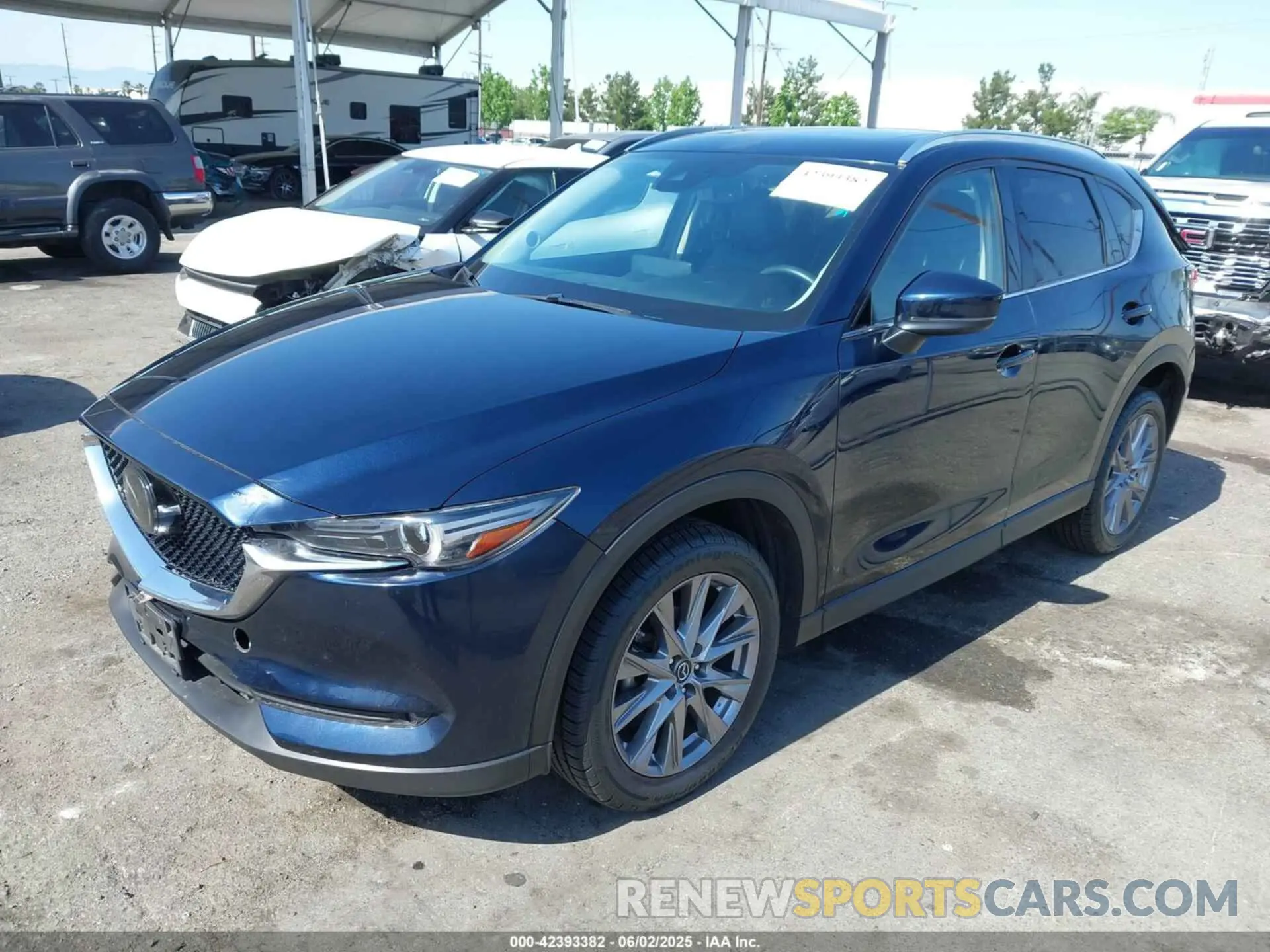 2 fotografías del automóvil dañado JM3KFADMXM0413521 MAZDA CX-5 2021