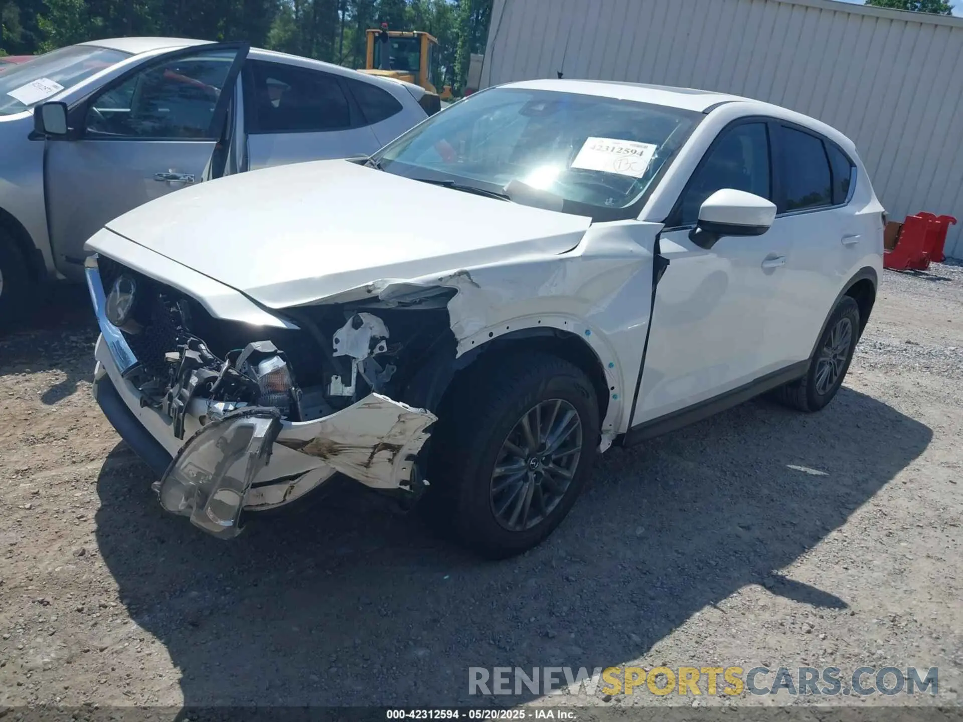 2 fotografías del automóvil dañado JM3KFBCM3M1363742 MAZDA CX-5 2021