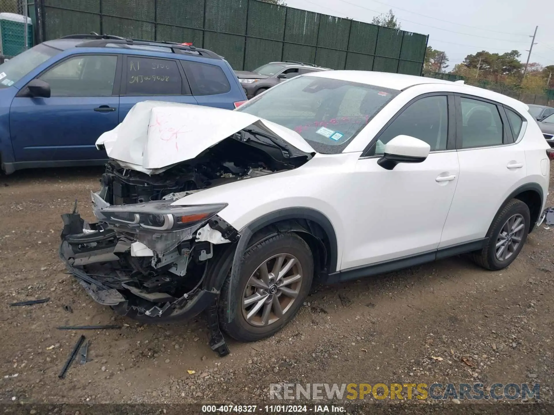 2 fotografías del automóvil dañado JM3KFBAM2N0534037 MAZDA CX-5 2022