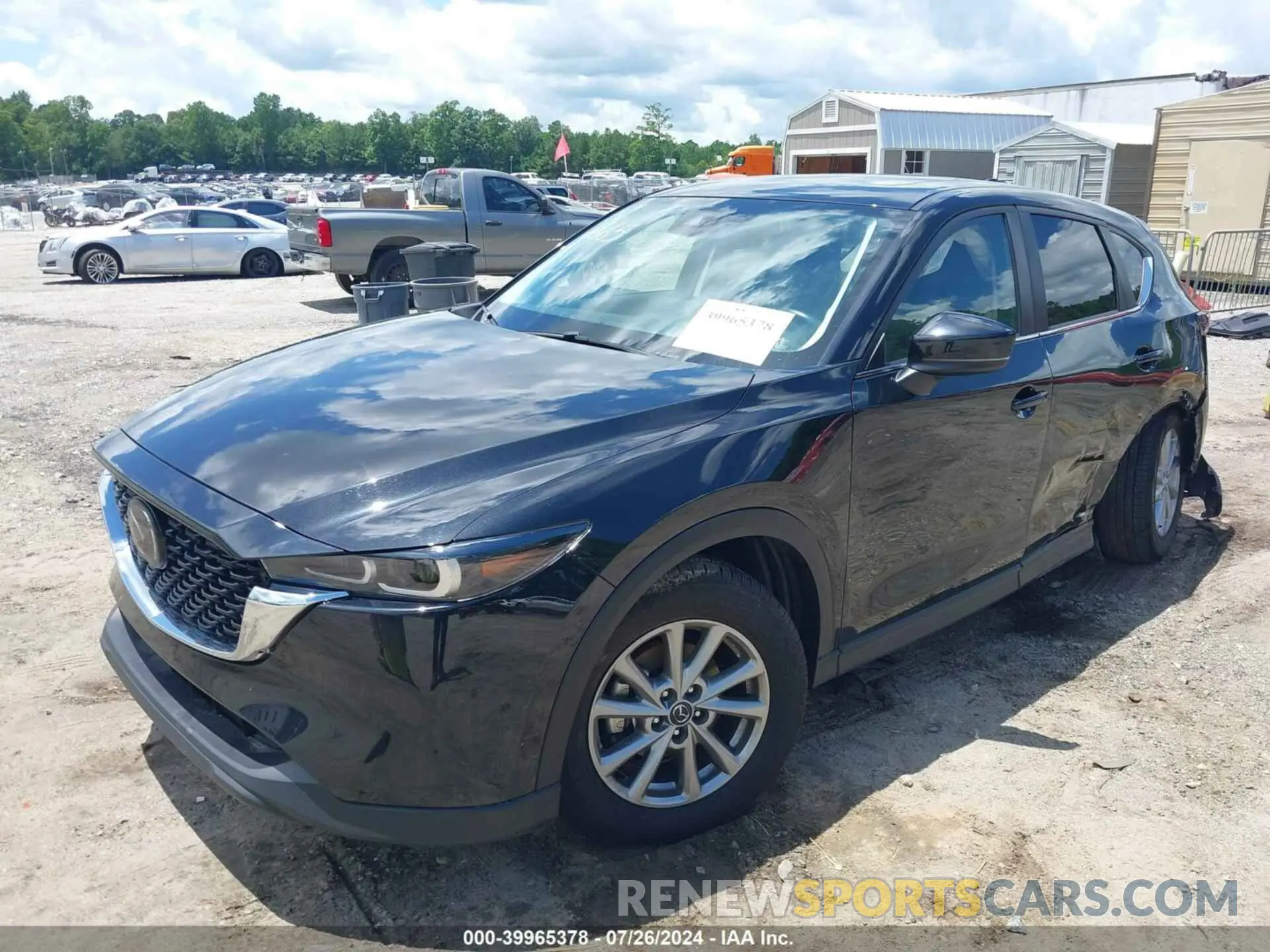 2 fotografías del automóvil dañado JM3KFBCMXP0201665 MAZDA CX-5 2023