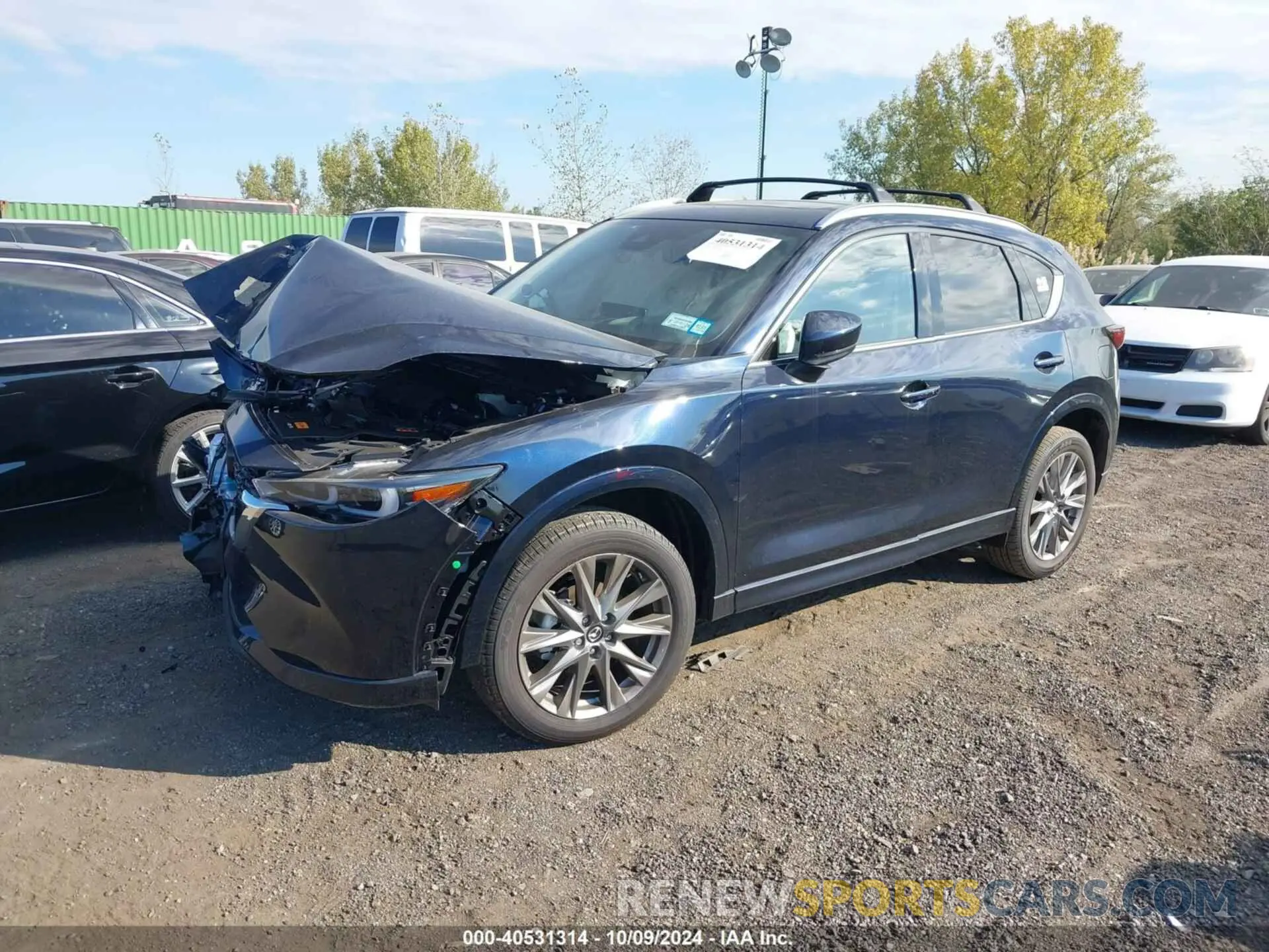 2 fotografías del automóvil dañado JM3KFBEL3R0521742 MAZDA CX-5 2024