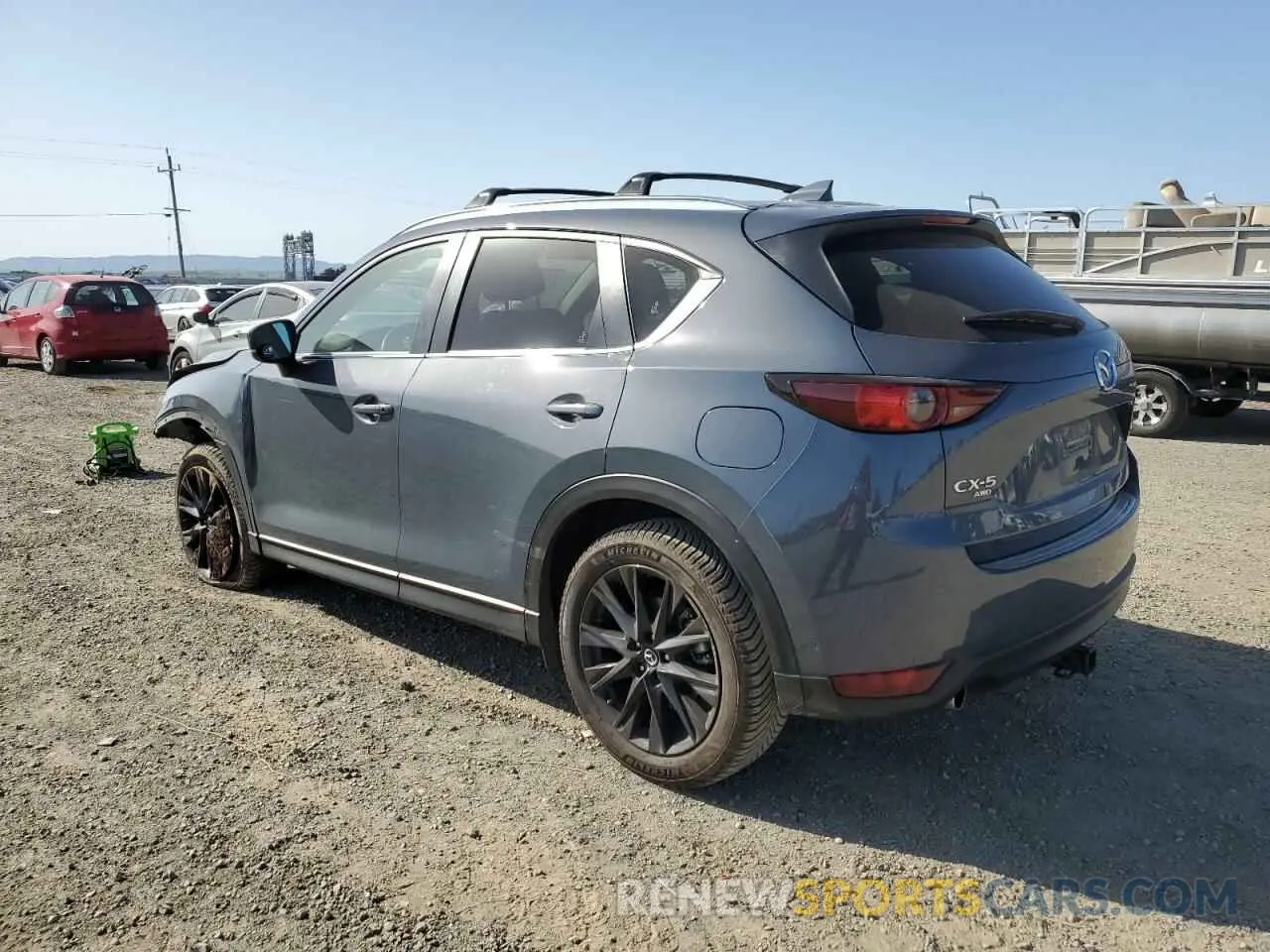 2 fotografías del automóvil dañado JM3KFBCY2M0386907 MAZDA CX-5 CARBO 2021