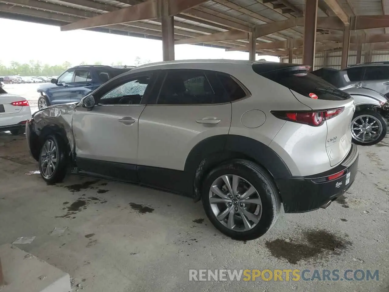 2 fotografías del automóvil dañado 3MVDMBBM2PM559542 MAZDA CX30 2023