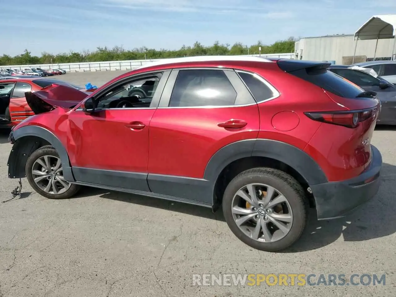 2 fotografías del automóvil dañado 3MVDMBBM4PM526302 MAZDA CX30 2023