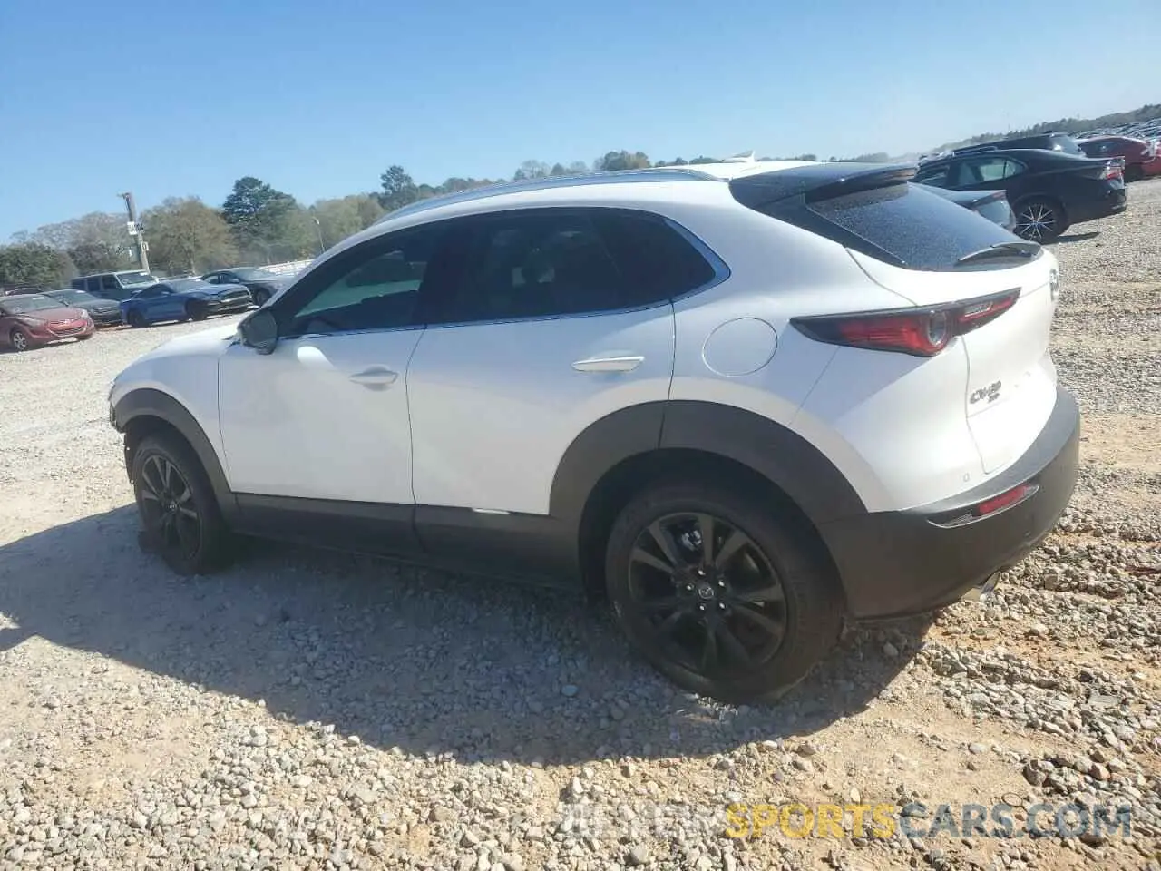 2 fotografías del automóvil dañado 3MVDMBEY0RM690146 MAZDA CX30 2024