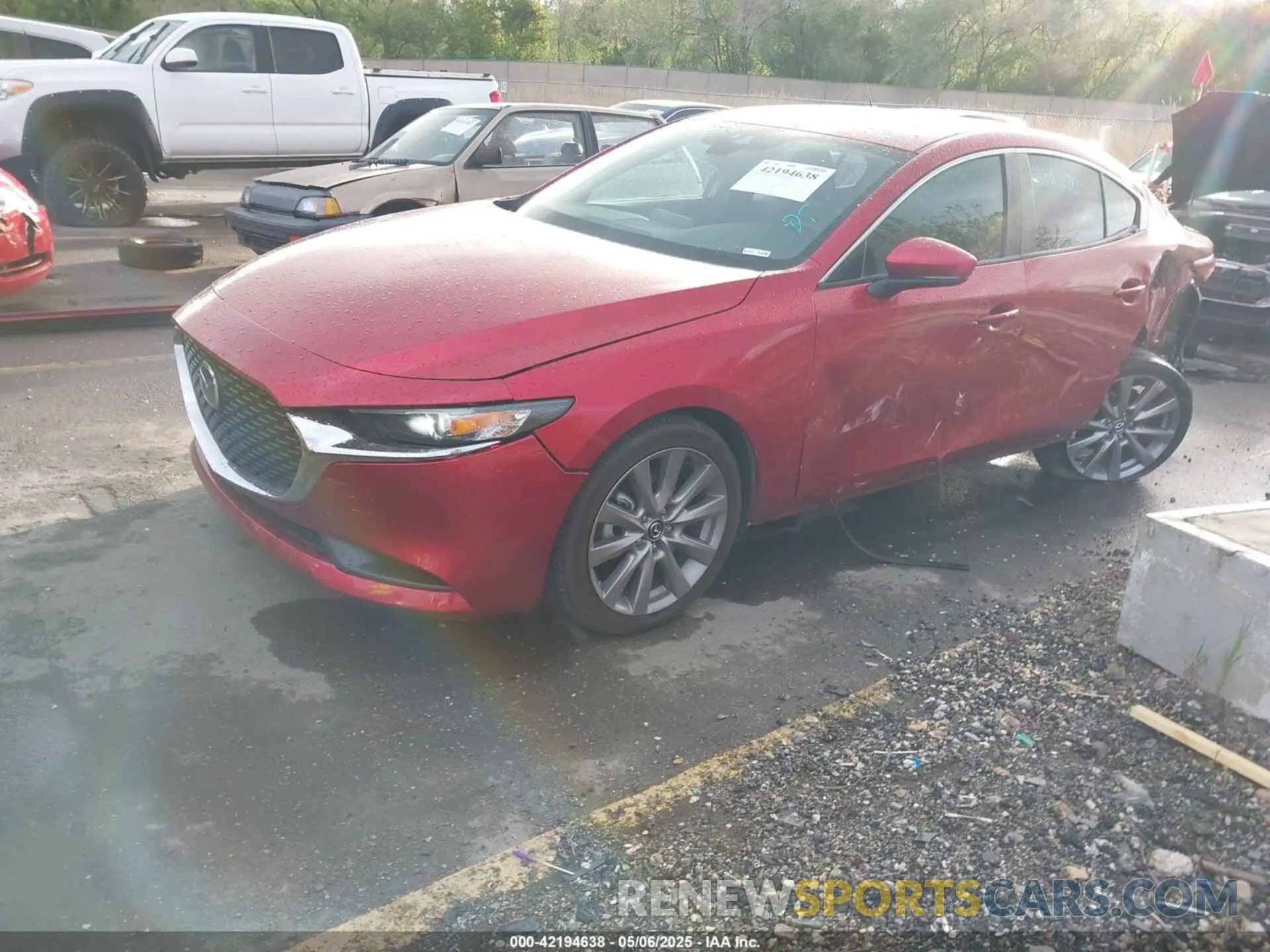 2 fotografías del automóvil dañado 3MZBPACL0MM252671 MAZDA MAZDA3 2021