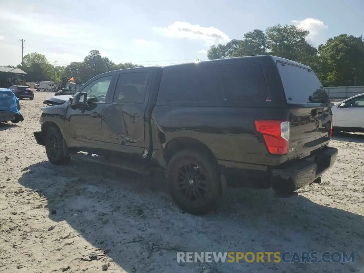 2 fotografías del automóvil dañado 1N6AA1E56KN522176 NISSAN TITAN 2019