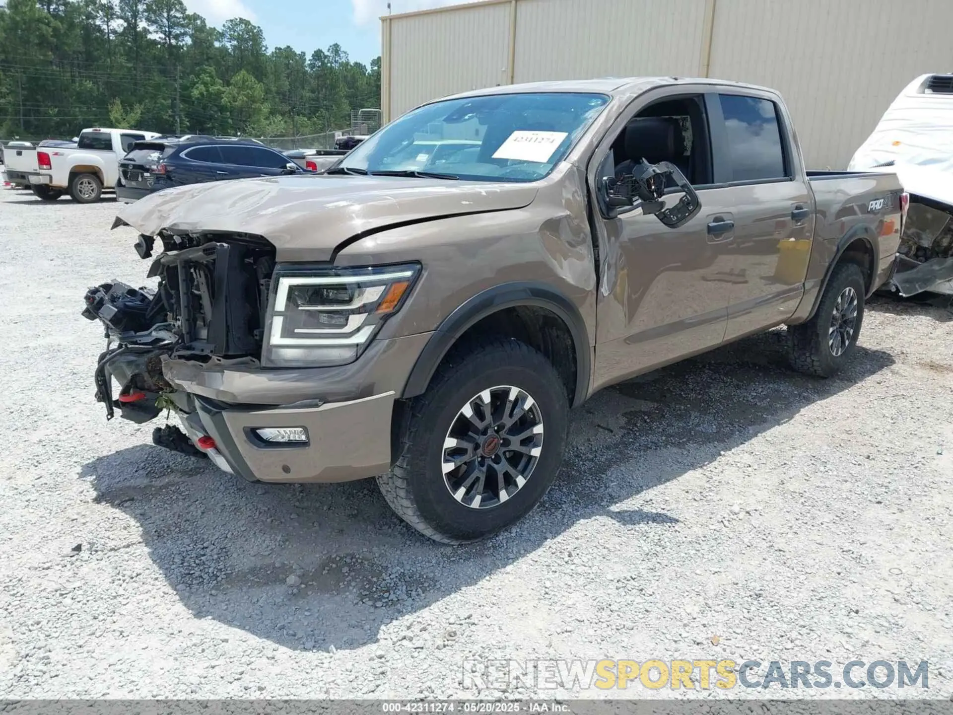 2 fotografías del automóvil dañado 1N6AA1ED0PN112536 NISSAN TITAN 2023