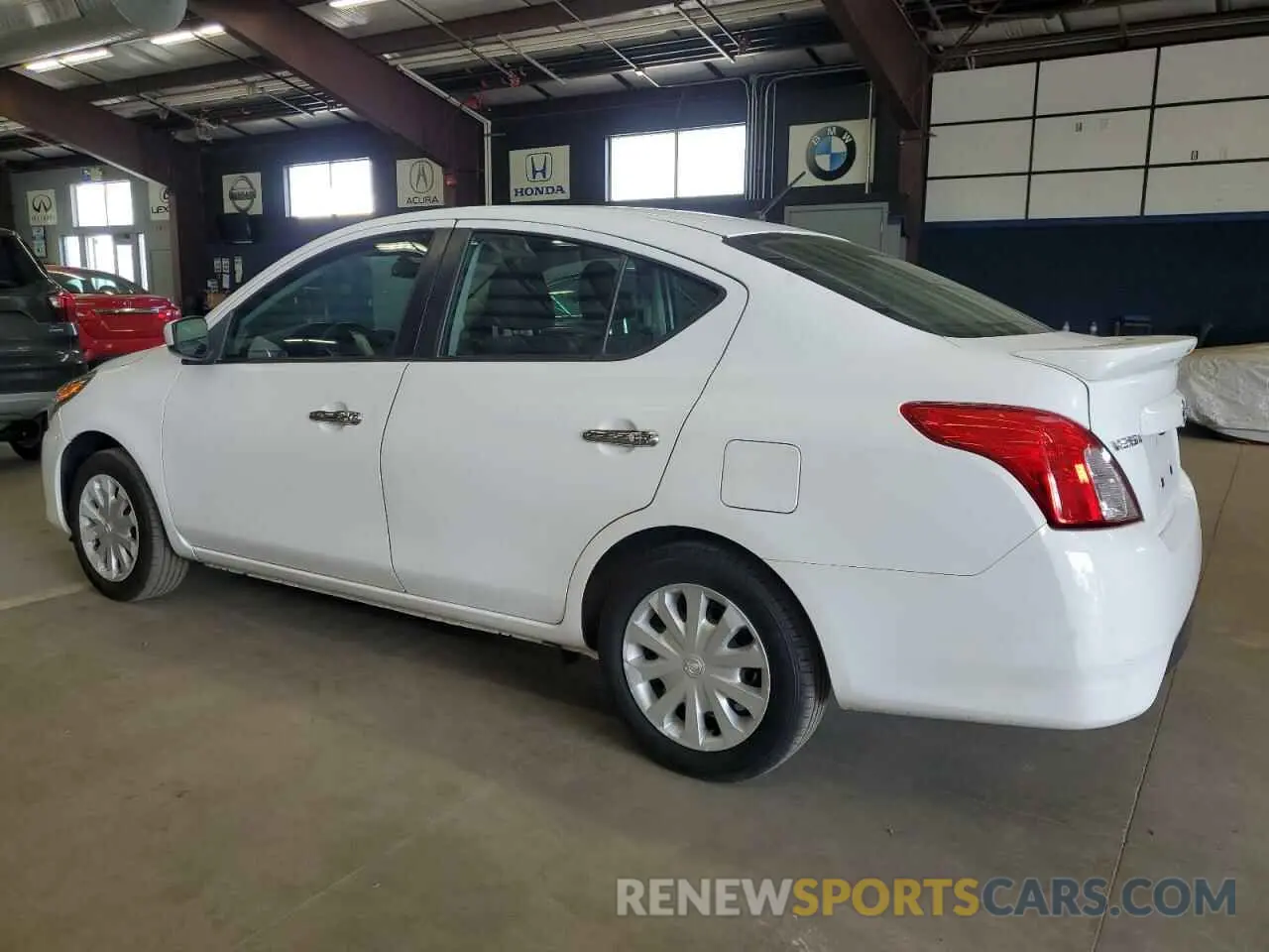 2 fotografías del automóvil dañado 3N1CN7AP4KL852069 NISSAN VERSA 2019
