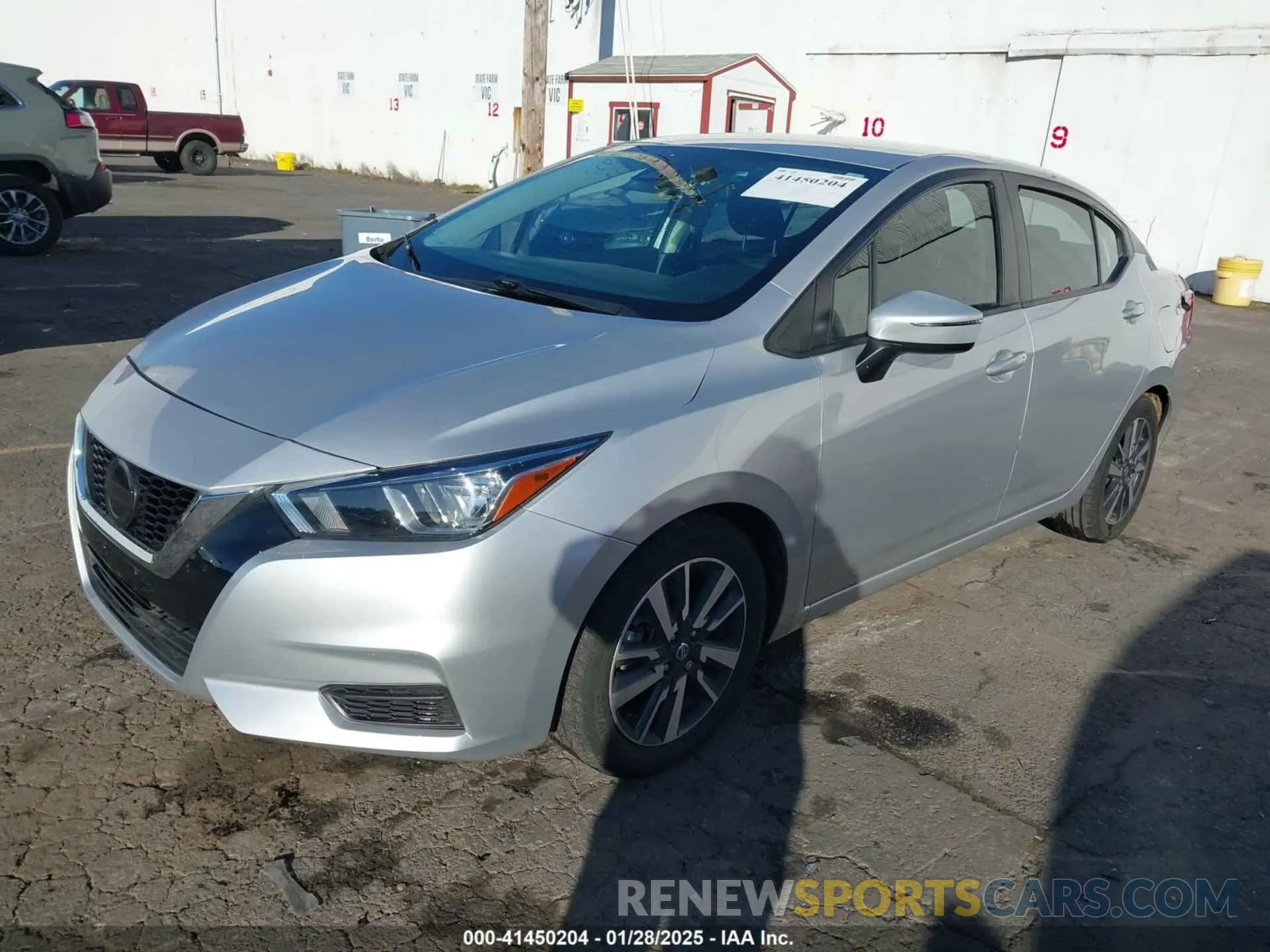 2 fotografías del automóvil dañado 3N1CN8EV2LL861384 NISSAN VERSA 2020