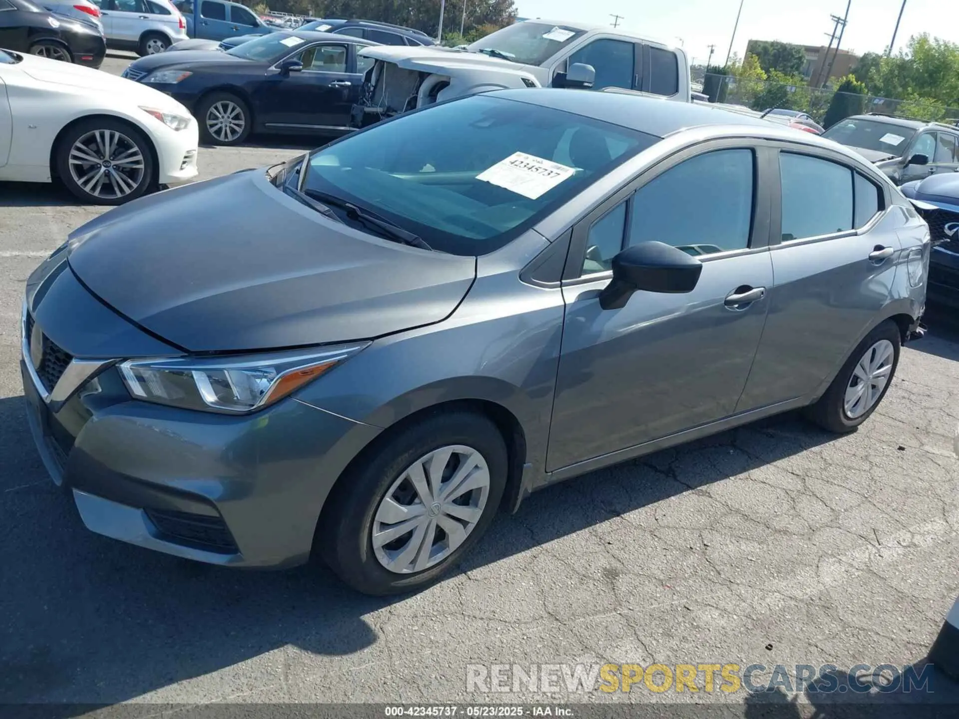 2 fotografías del automóvil dañado 3N1CN8DV0ML860009 NISSAN VERSA 2021