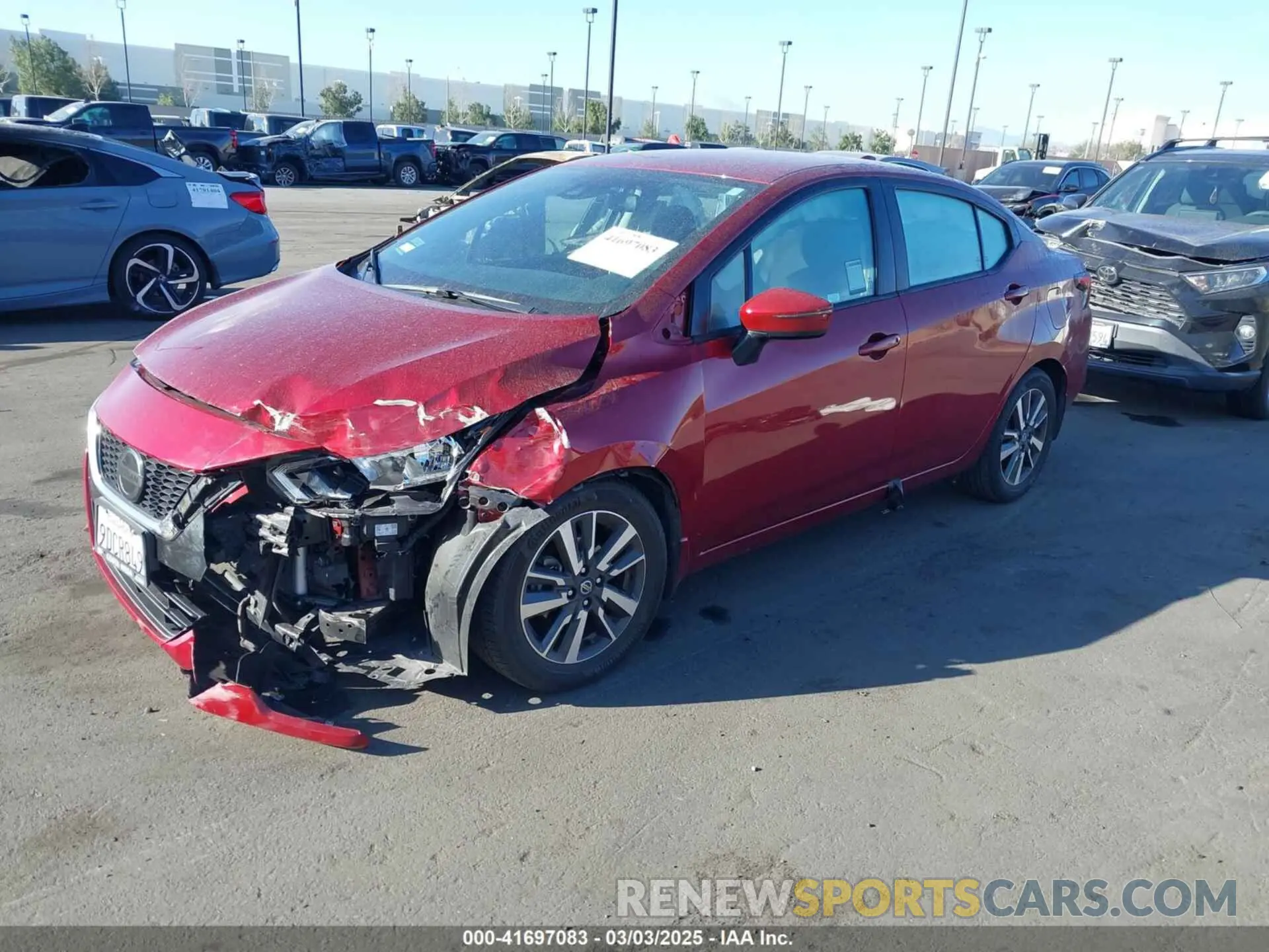 2 fotografías del automóvil dañado 3N1CN8EV7ML859406 NISSAN VERSA 2021
