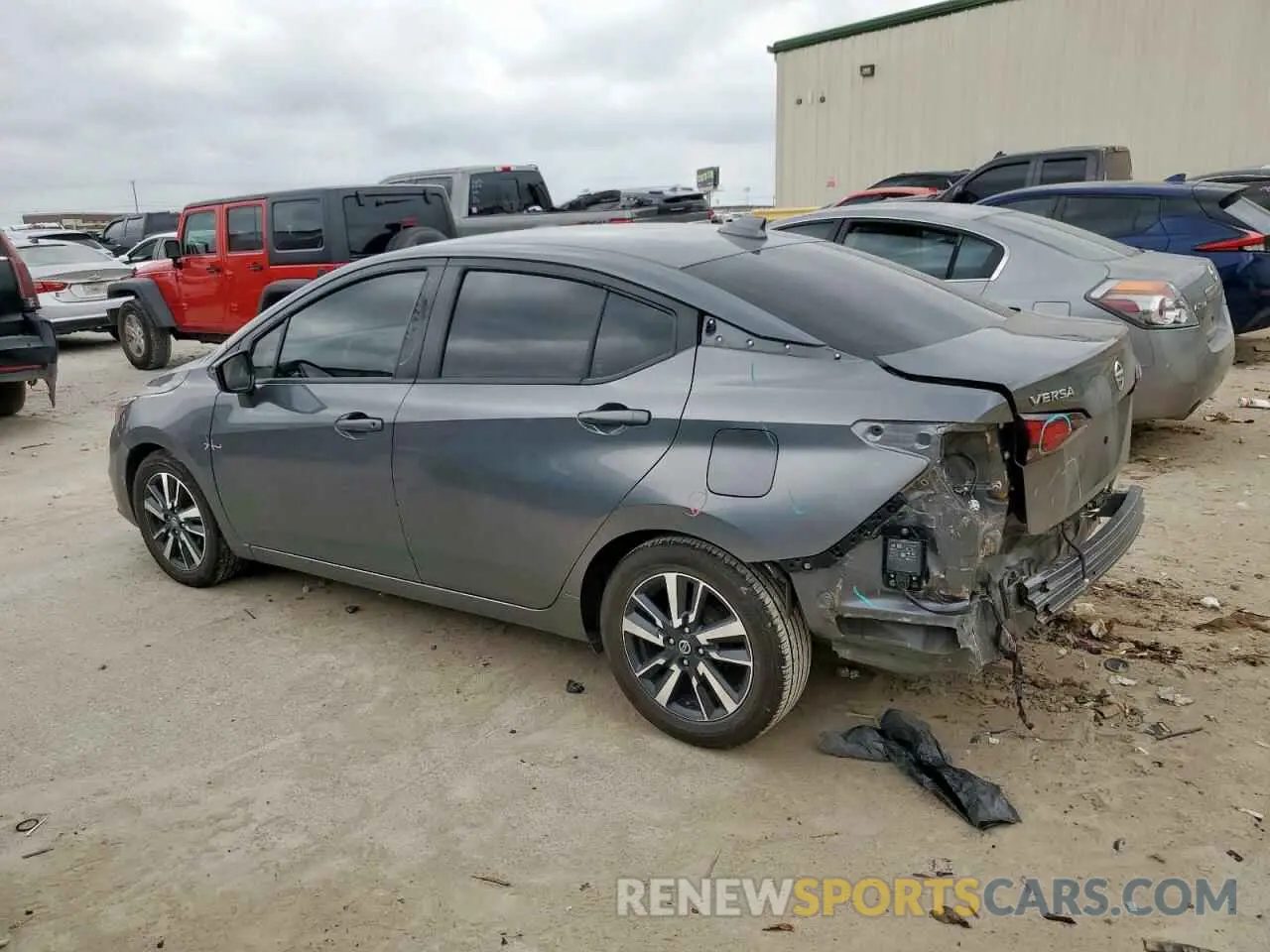 2 fotografías del automóvil dañado 3N1CN8EVXML841207 NISSAN VERSA 2021