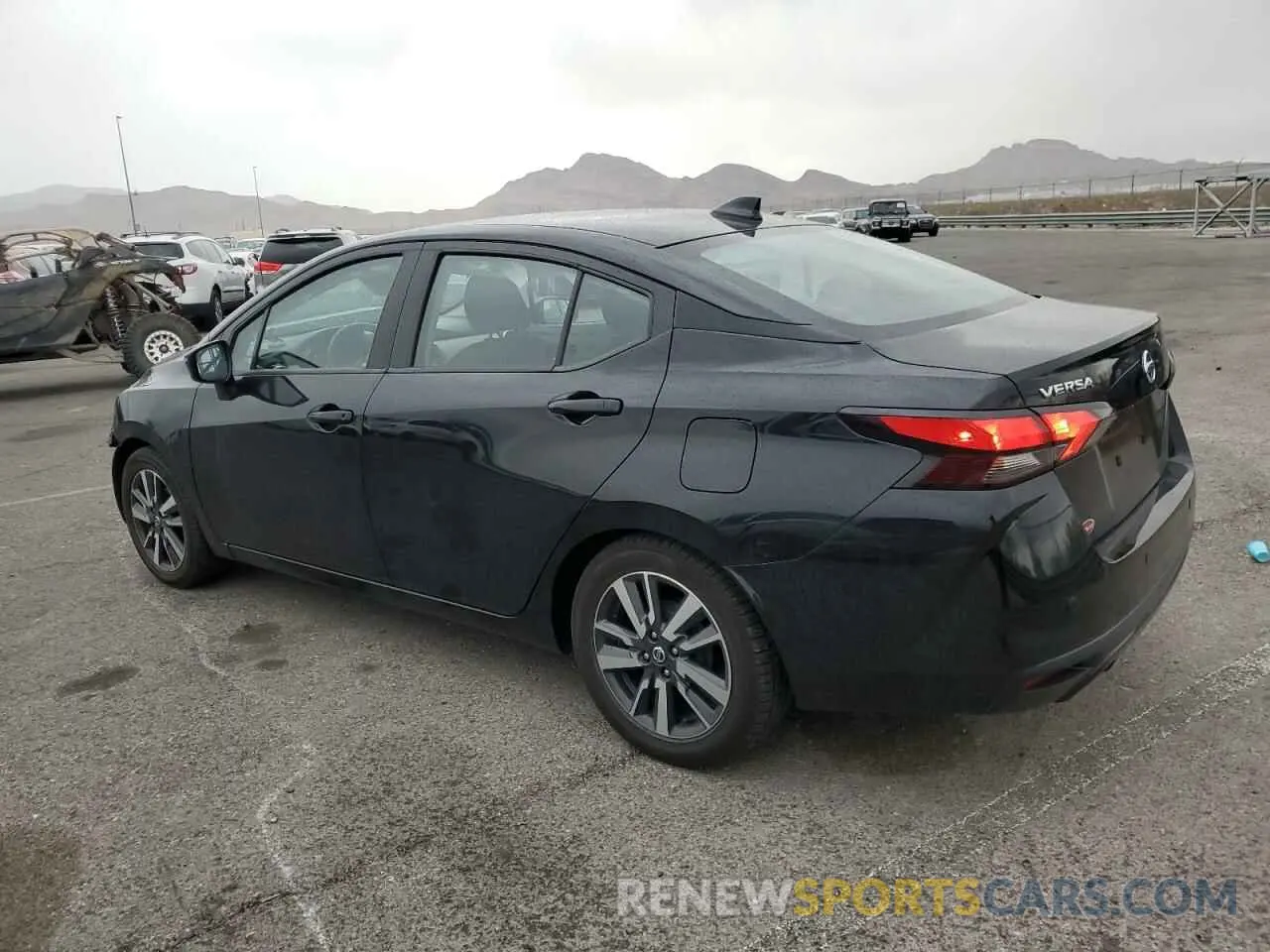 2 fotografías del automóvil dañado 3N1CN8EVXML876572 NISSAN VERSA 2021
