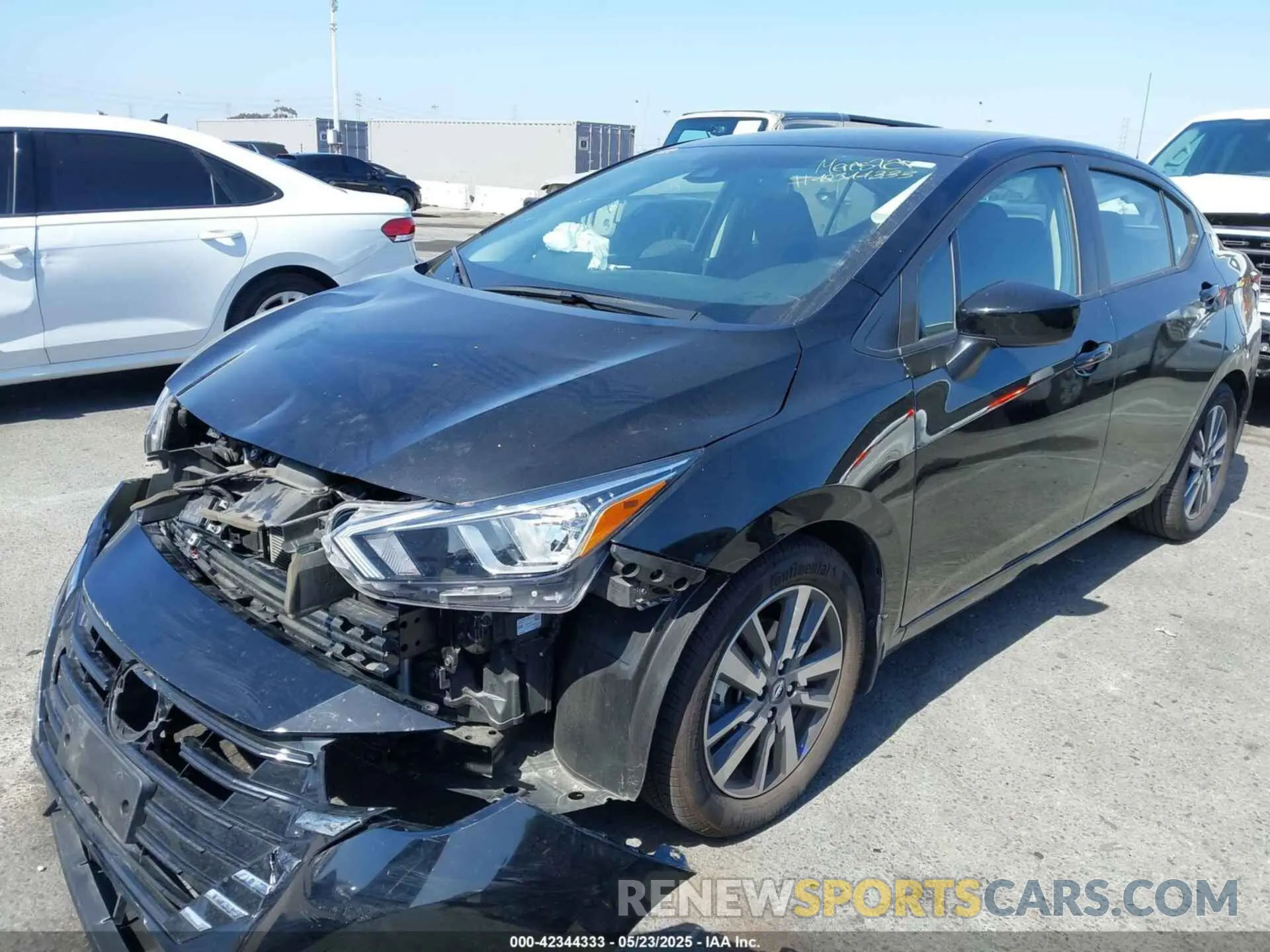 2 fotografías del automóvil dañado 3N1CN8EV0PL864631 NISSAN VERSA 2023