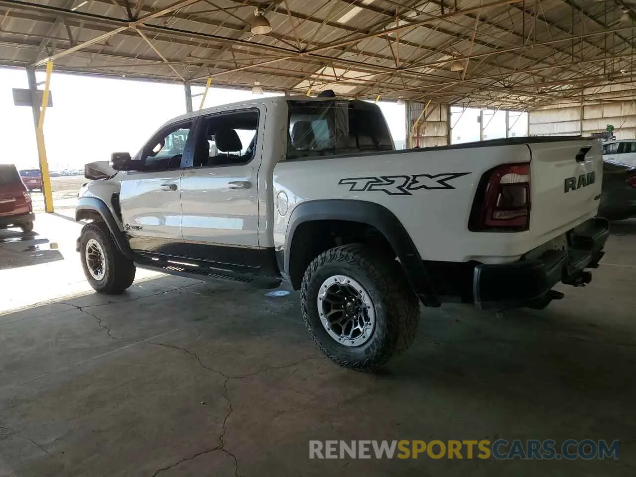 2 fotografías del automóvil dañado 1C6SRFU94MN764282 RAM 1500 2021