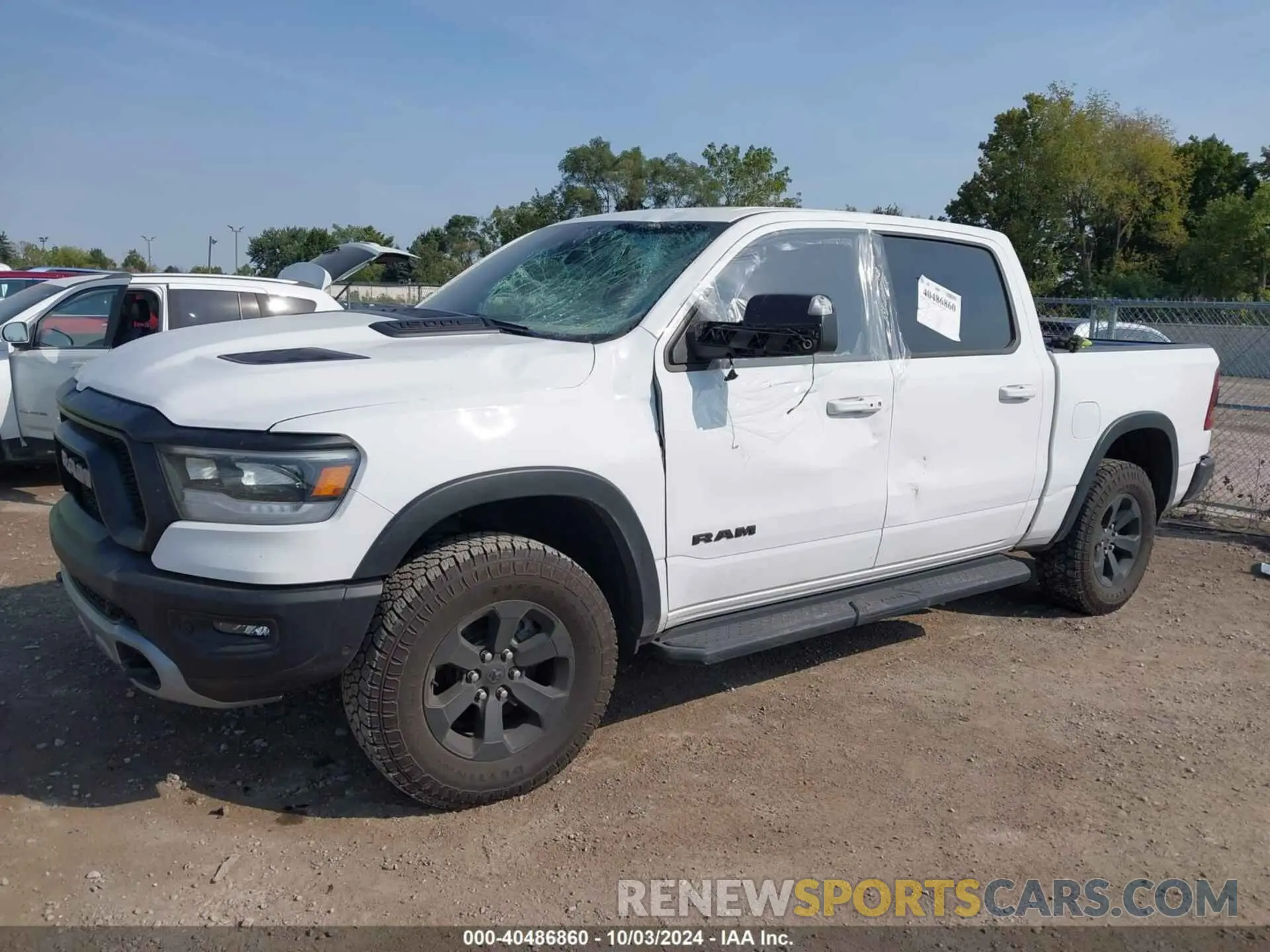 2 fotografías del automóvil dañado 1C6SRFLTXNN338532 RAM 1500 2022
