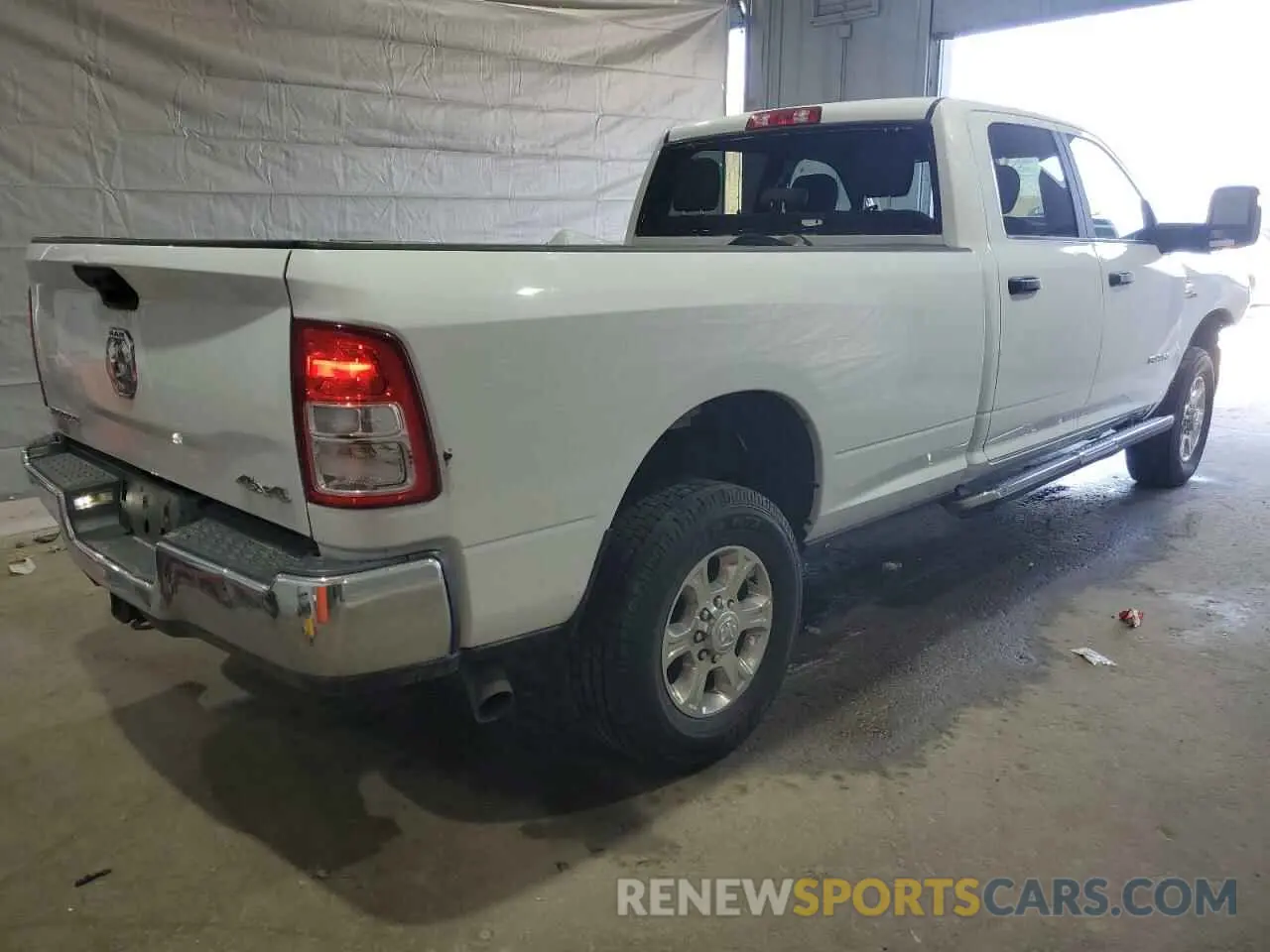 3 fotografías del automóvil dañado 3C6UR5JL6PG587668 RAM 2500 2023